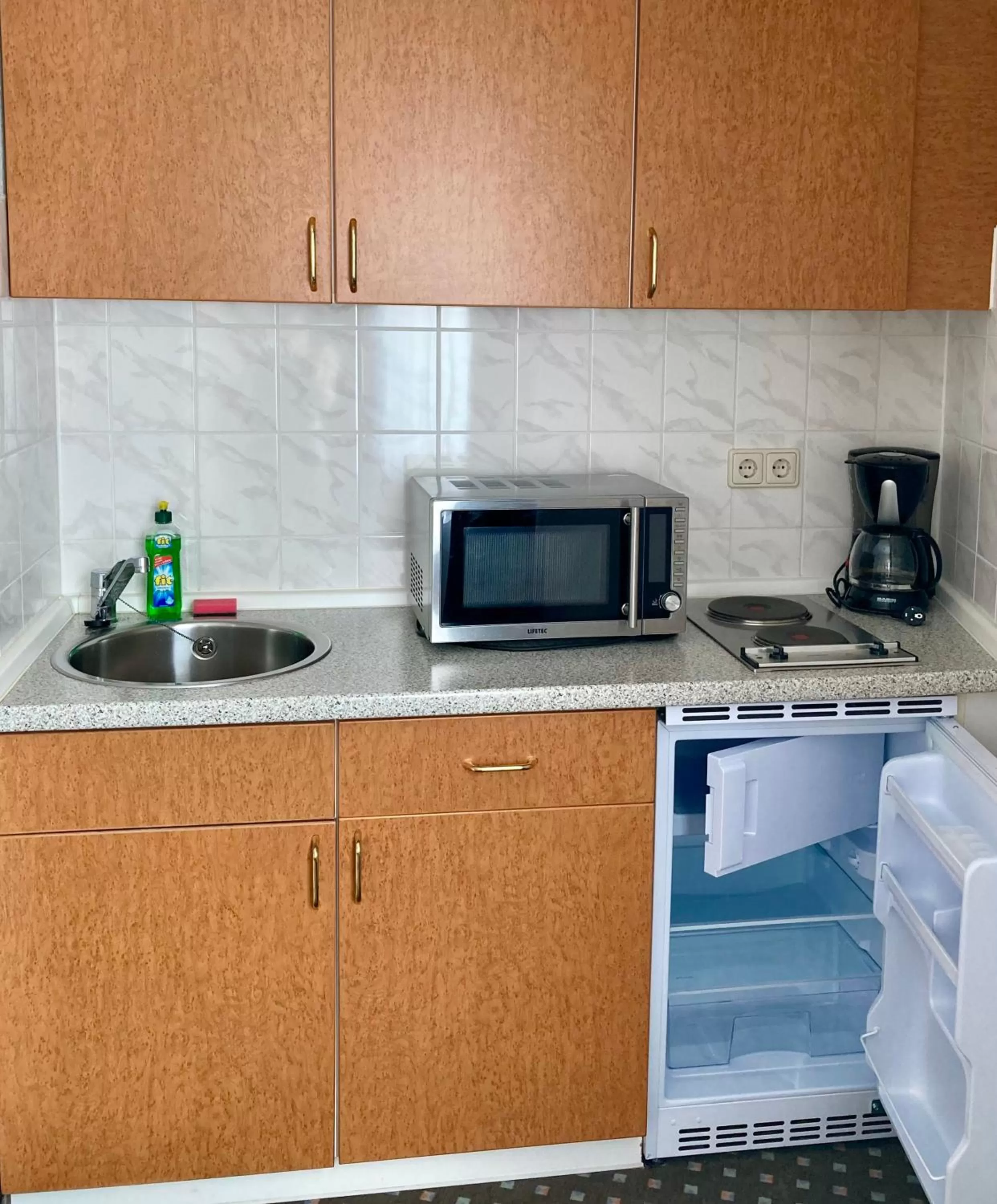 Kitchen or kitchenette in Akzent Congresshotel Hoyerswerda