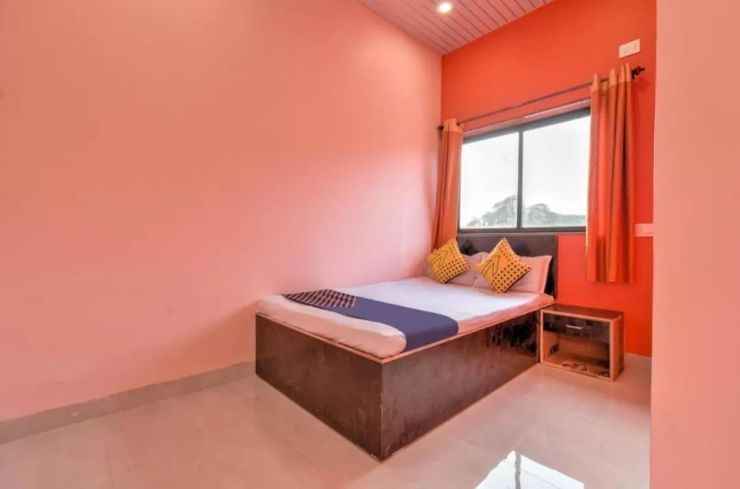 Bed in Hotel Nisarg Lodging And Restaurant