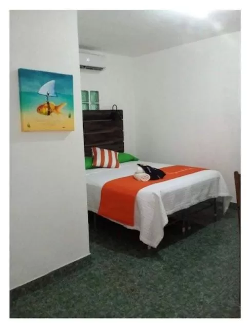 Double Room with Garden View in Beach Club Budget Rooms at Popeyes Caye Caulker