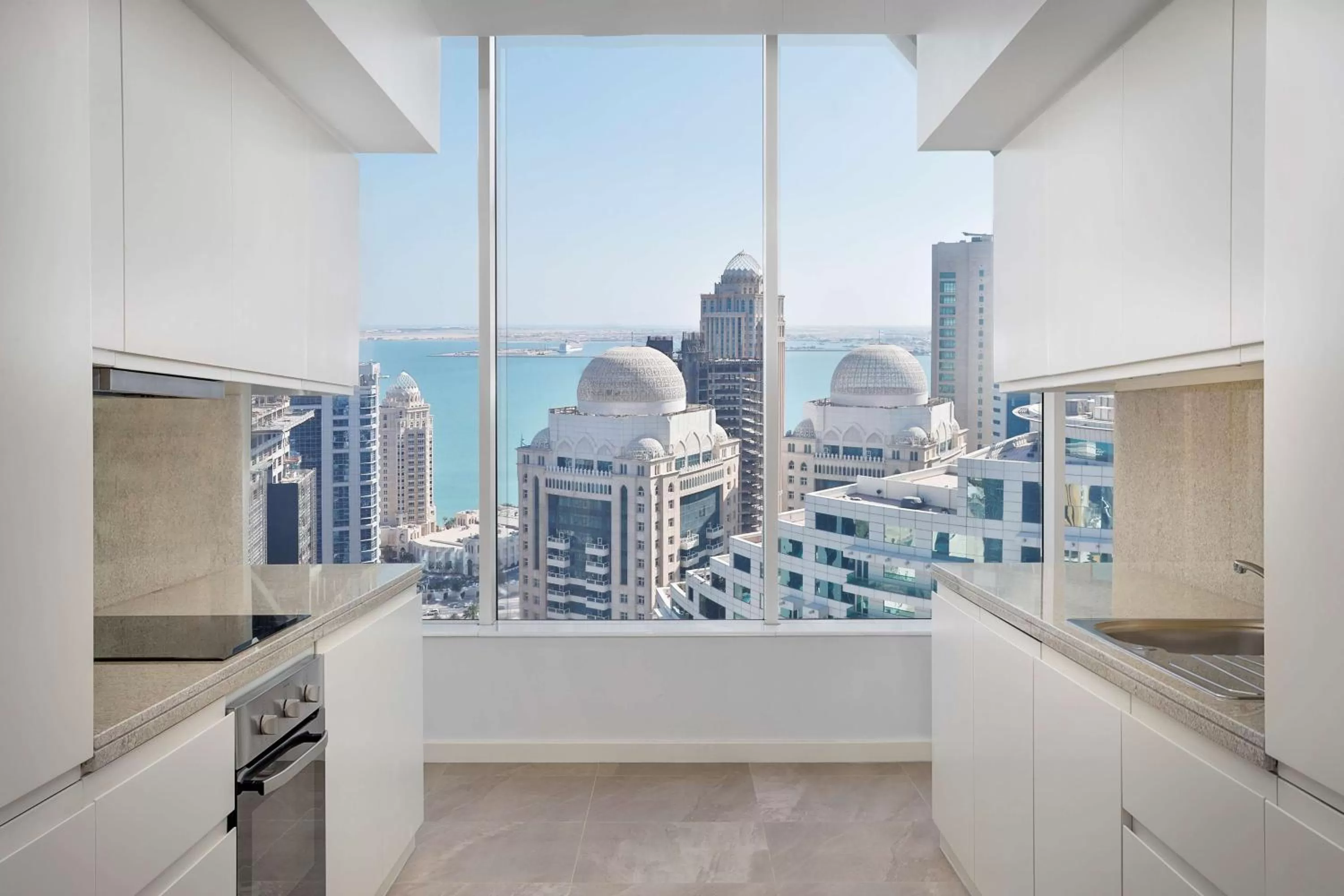 Kitchen or kitchenette in Aleph Doha Residences, Curio Collection By Hilton