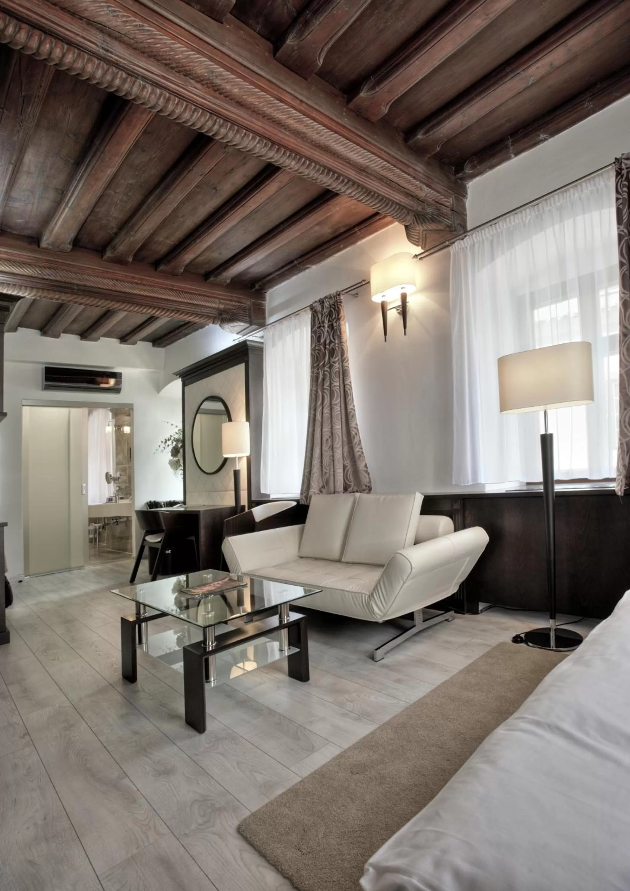 Seating area, Bed in Hotel Grand