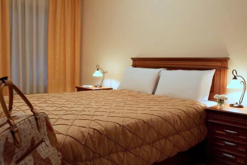 Bed in Famissi Hotel