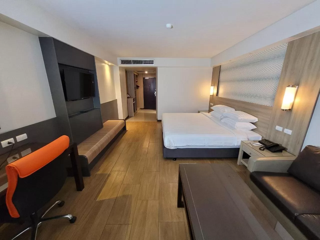 Bed in Dynasty Grande Hotel