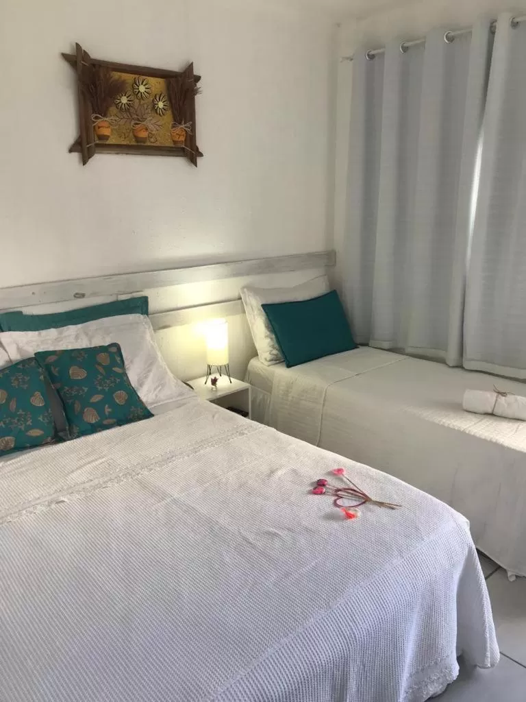 Bed in Pousada America do Sol