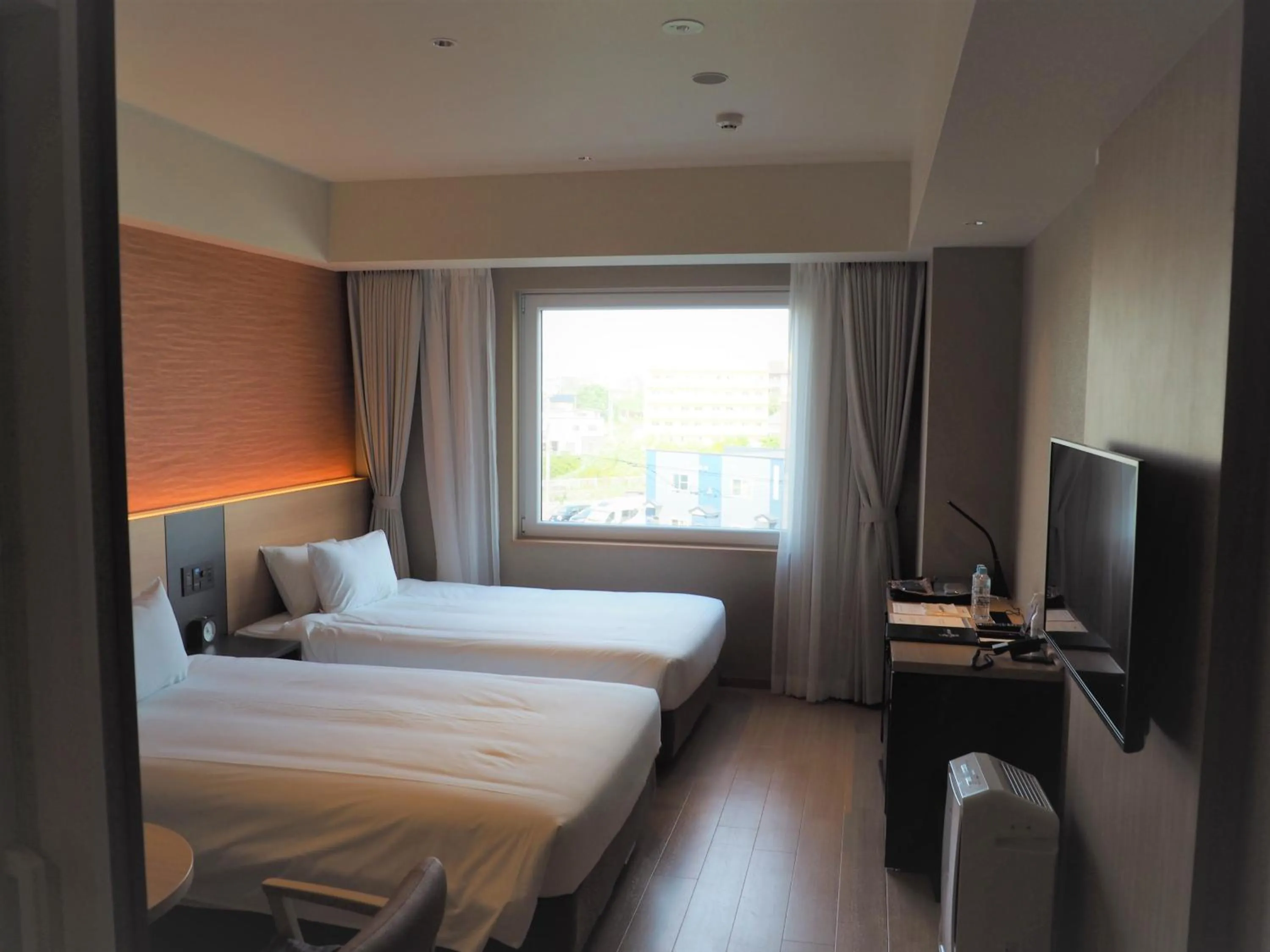 View (from property/room), Bed in Hakodate Yunokawa Onsen Umi to Akari Hewitt Resort