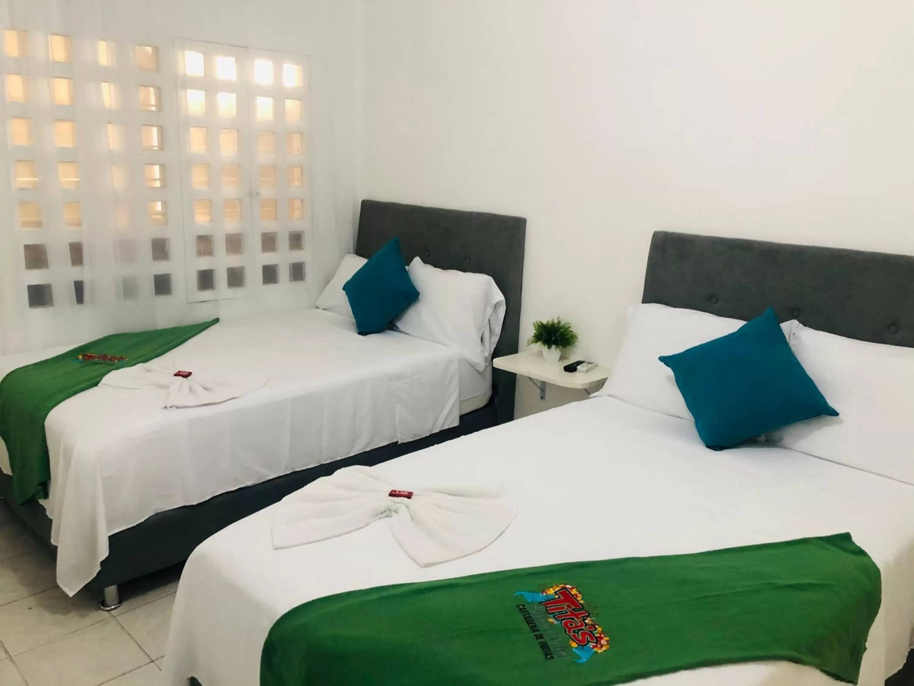 Bed in Tita’s Airport Hotel