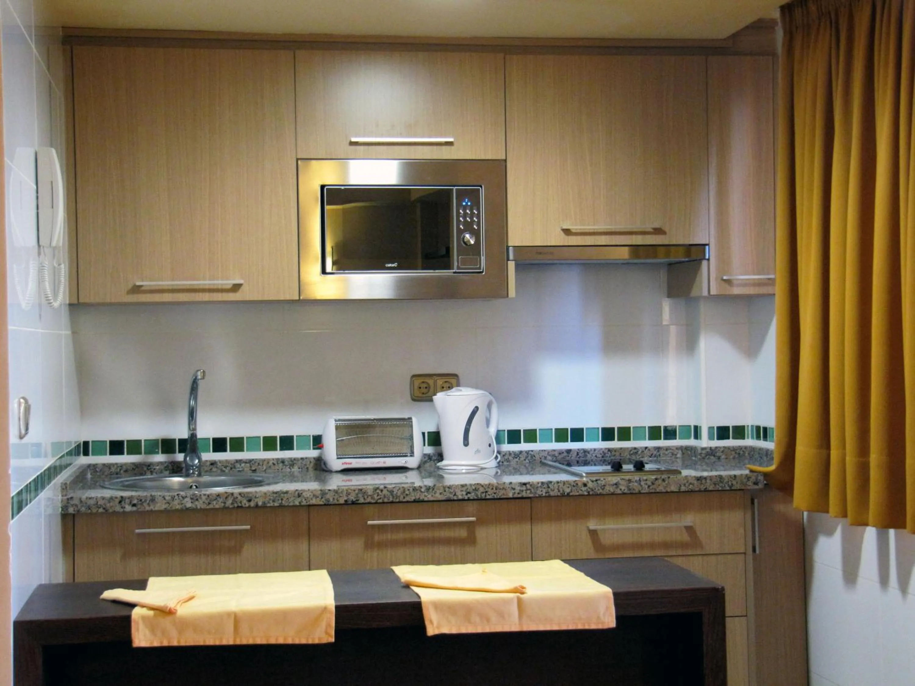 Kitchen or kitchenette in Apartamentos MS Pepita