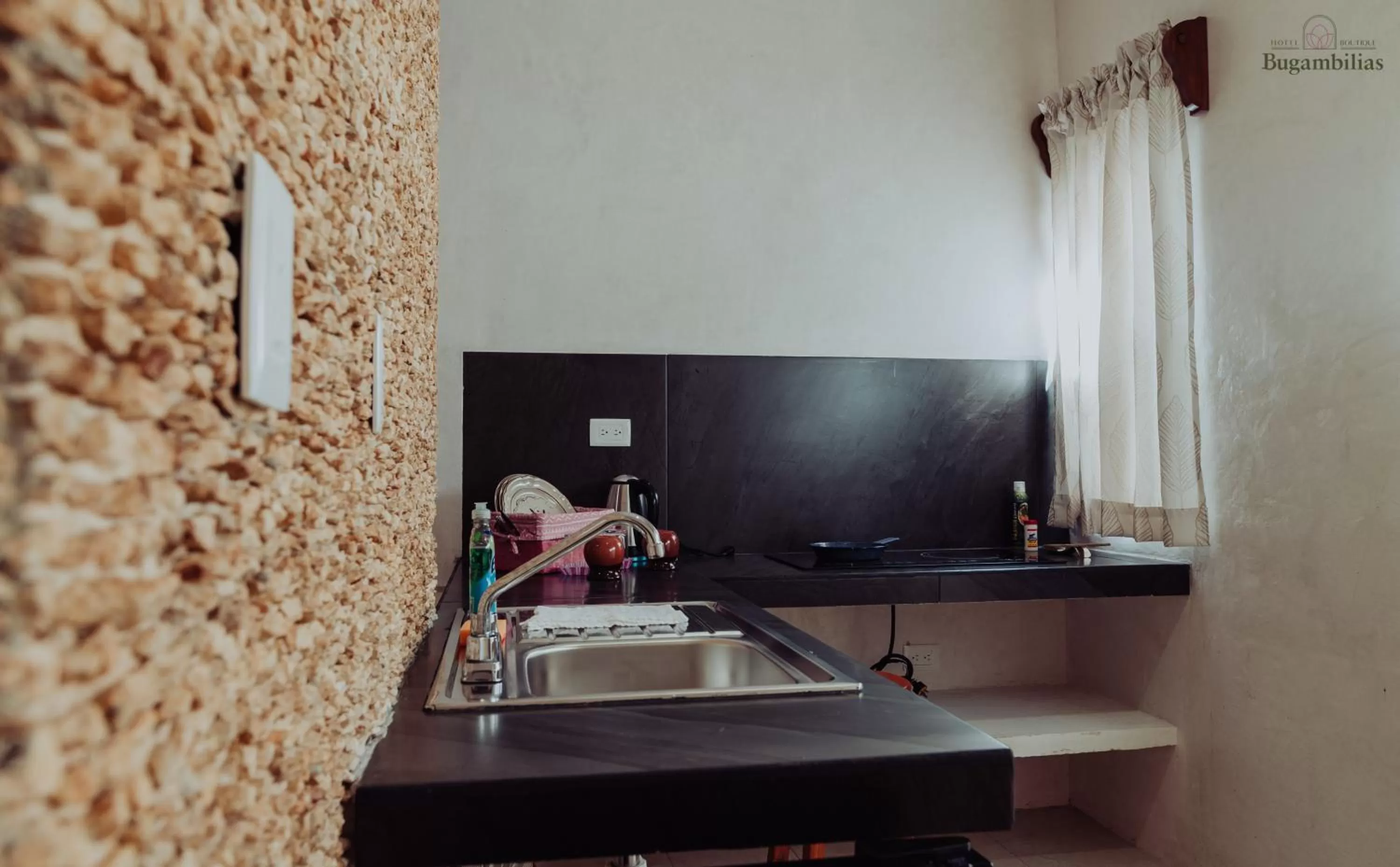 Kitchen or kitchenette in Hotel Boutique Bugambilias