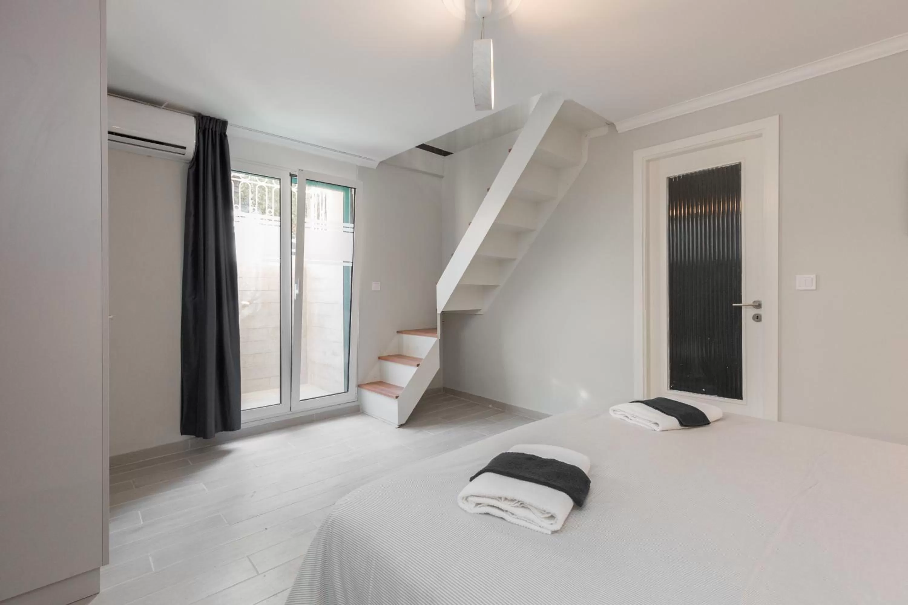 Bed in Troon of Athens Apartments