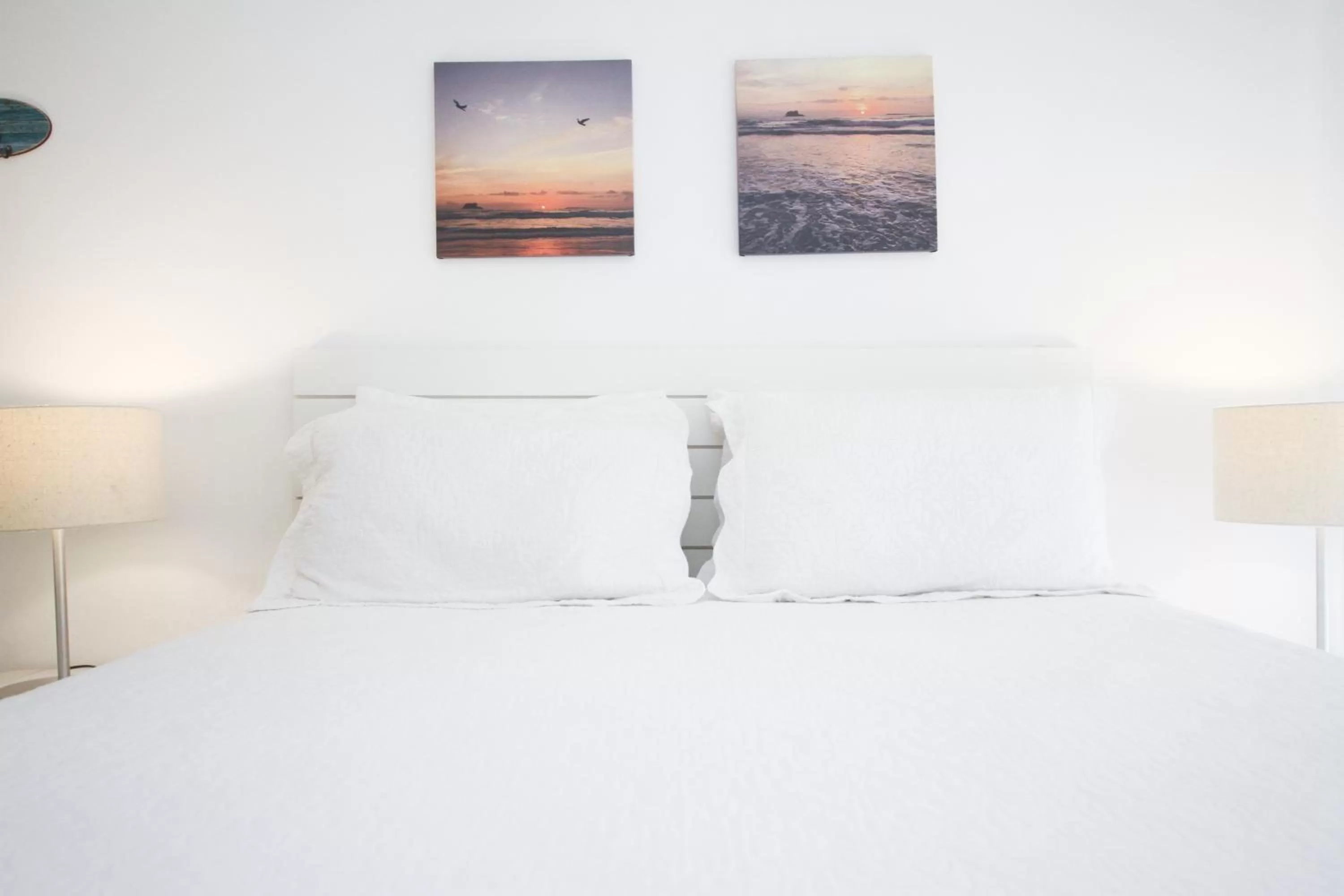 Bed in Guest House Guarujá