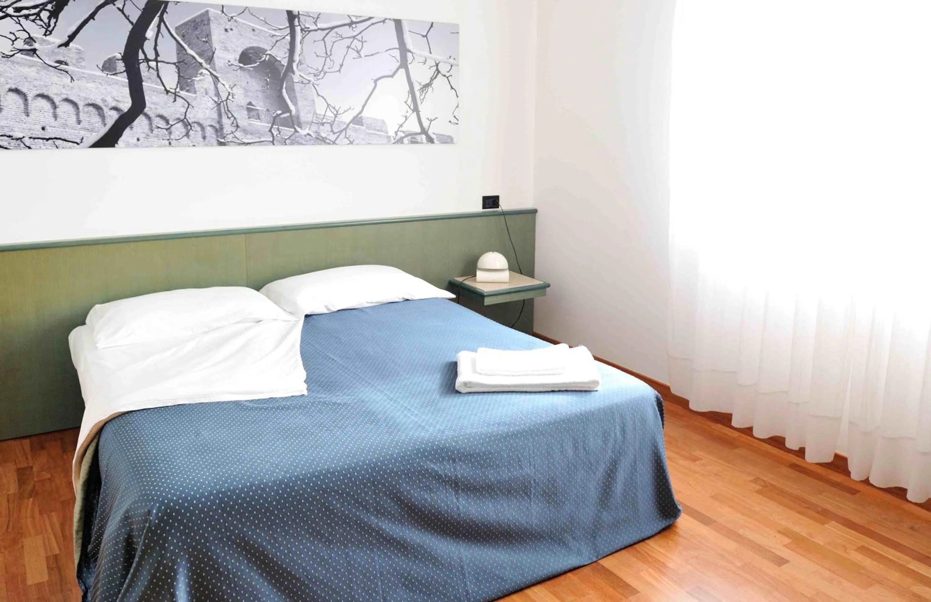 Bed in Rometta Hotel