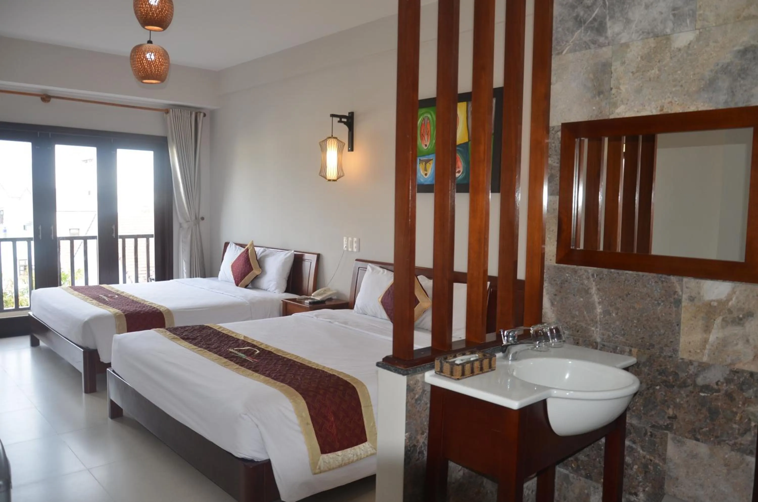 Bed in Sunshine Hoian Hotel