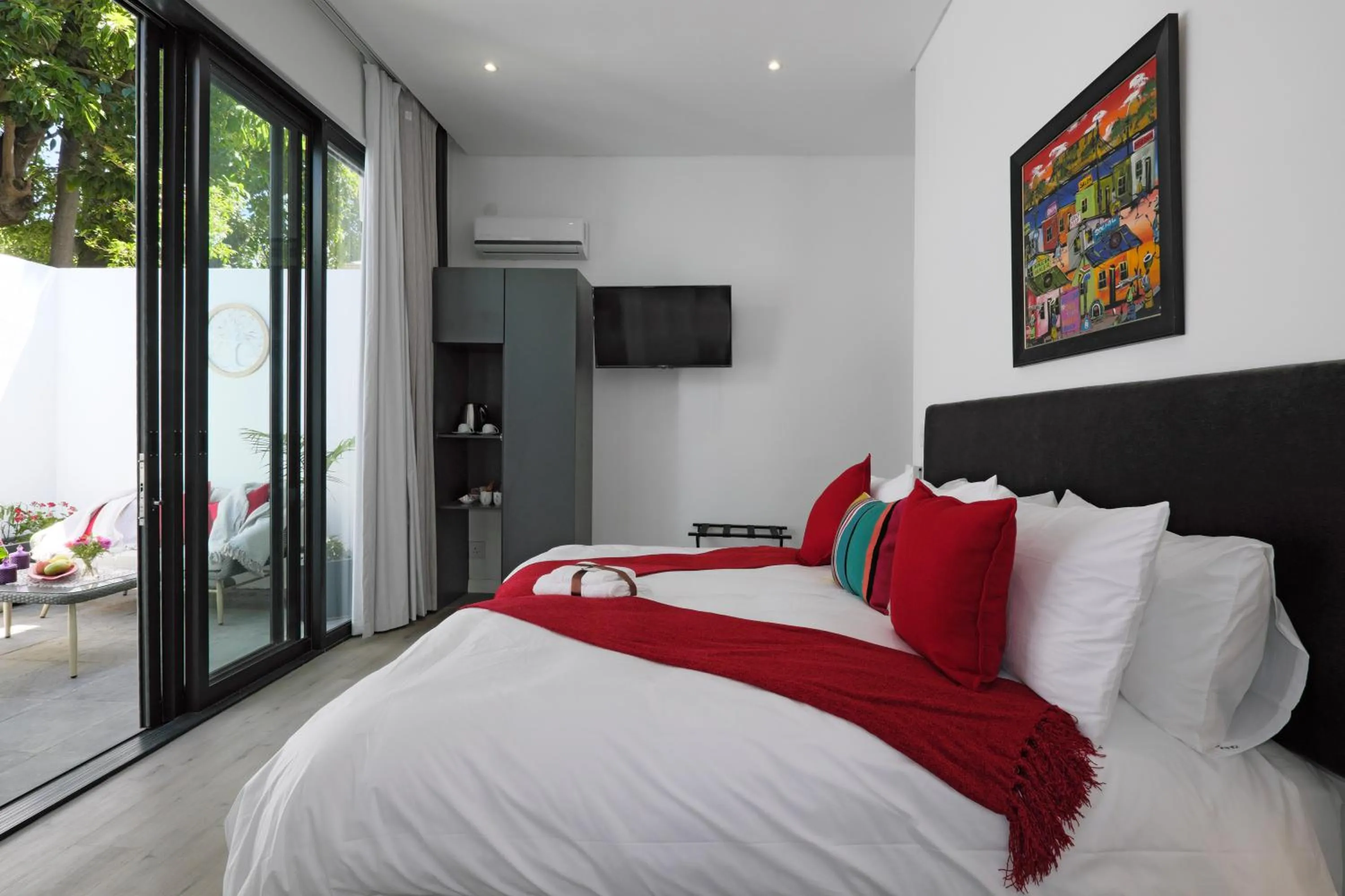 Bed in Point B Guest House -Sustainable Solar Energy