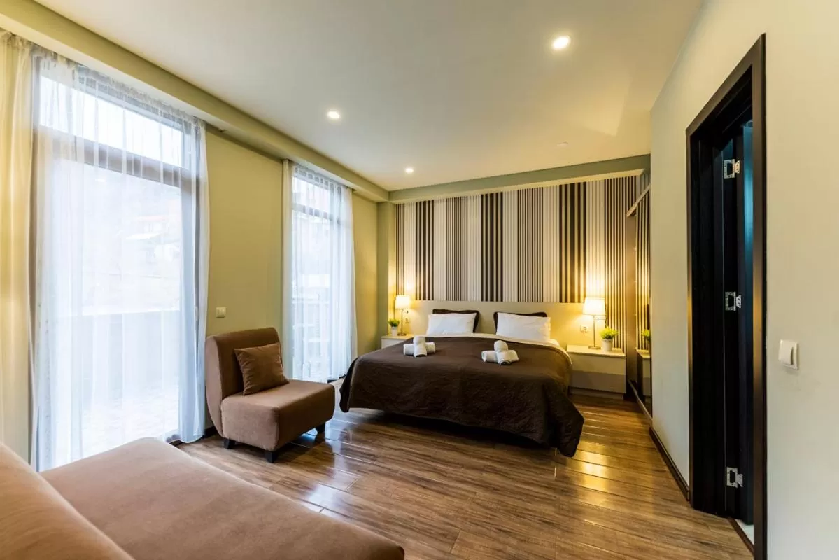 Bed in Sani Apart Hotel