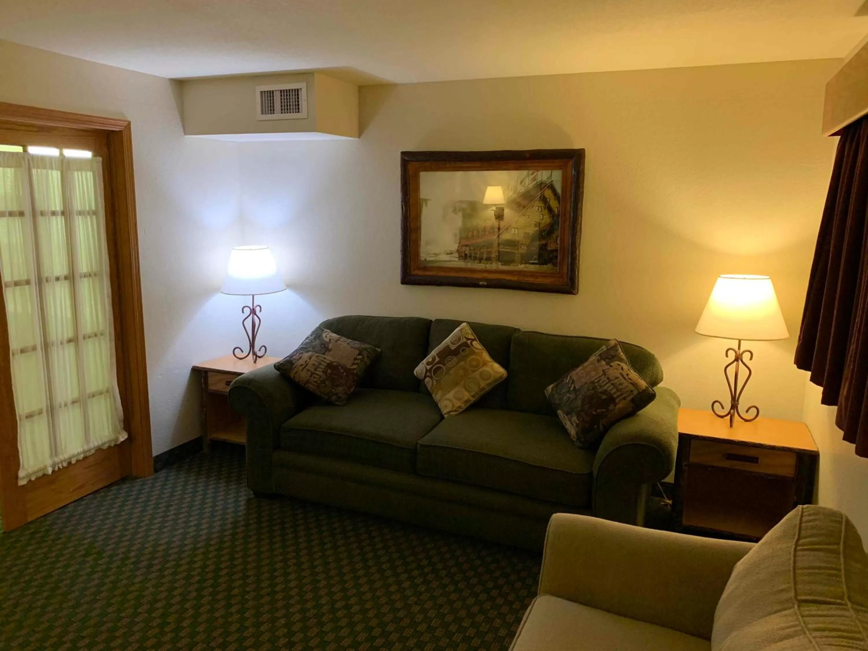 Seating area in AmericInn by Wyndham Cody