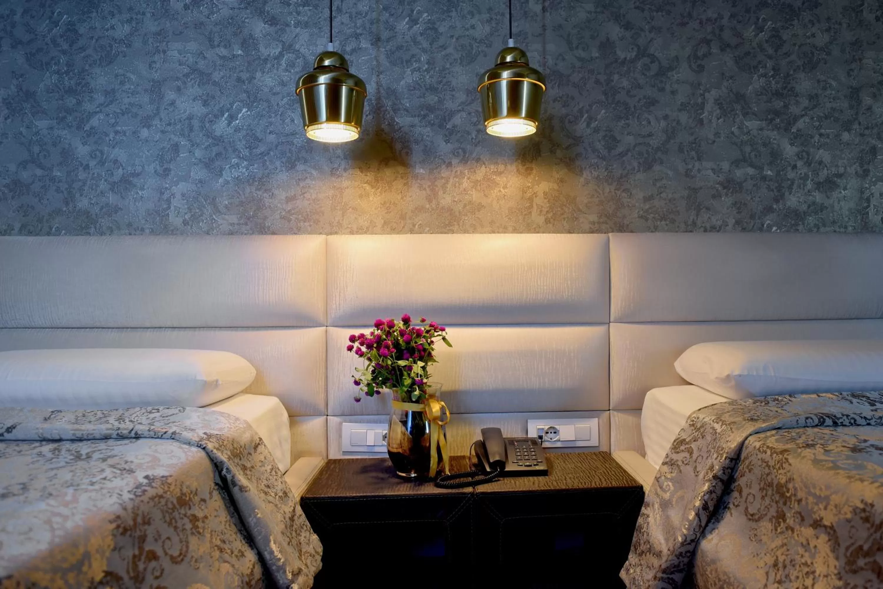 Bed in La Bohème Hotel