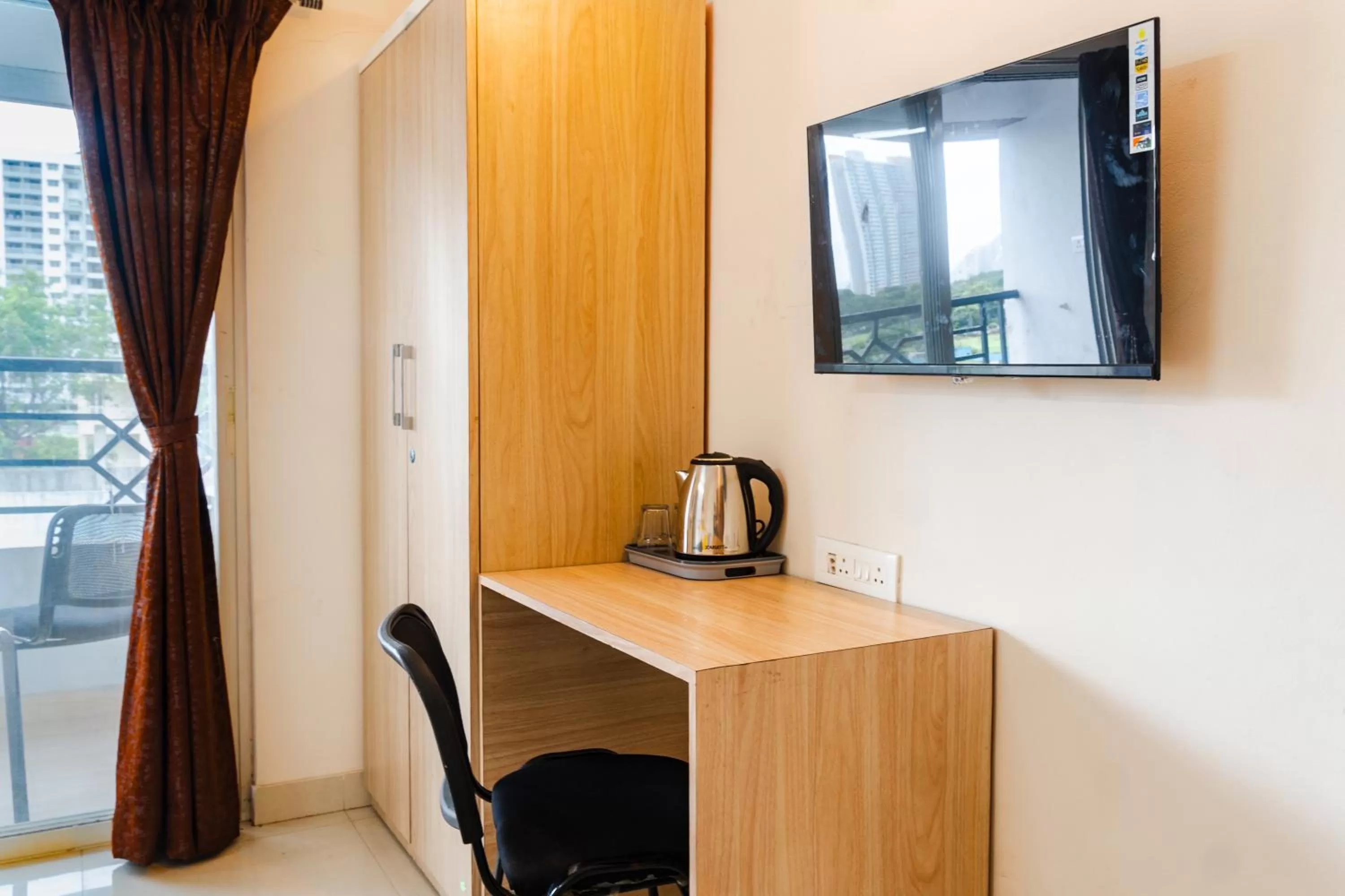 TV and multimedia, TV/Entertainment Center in Itsy By Treebo - Opal Suites