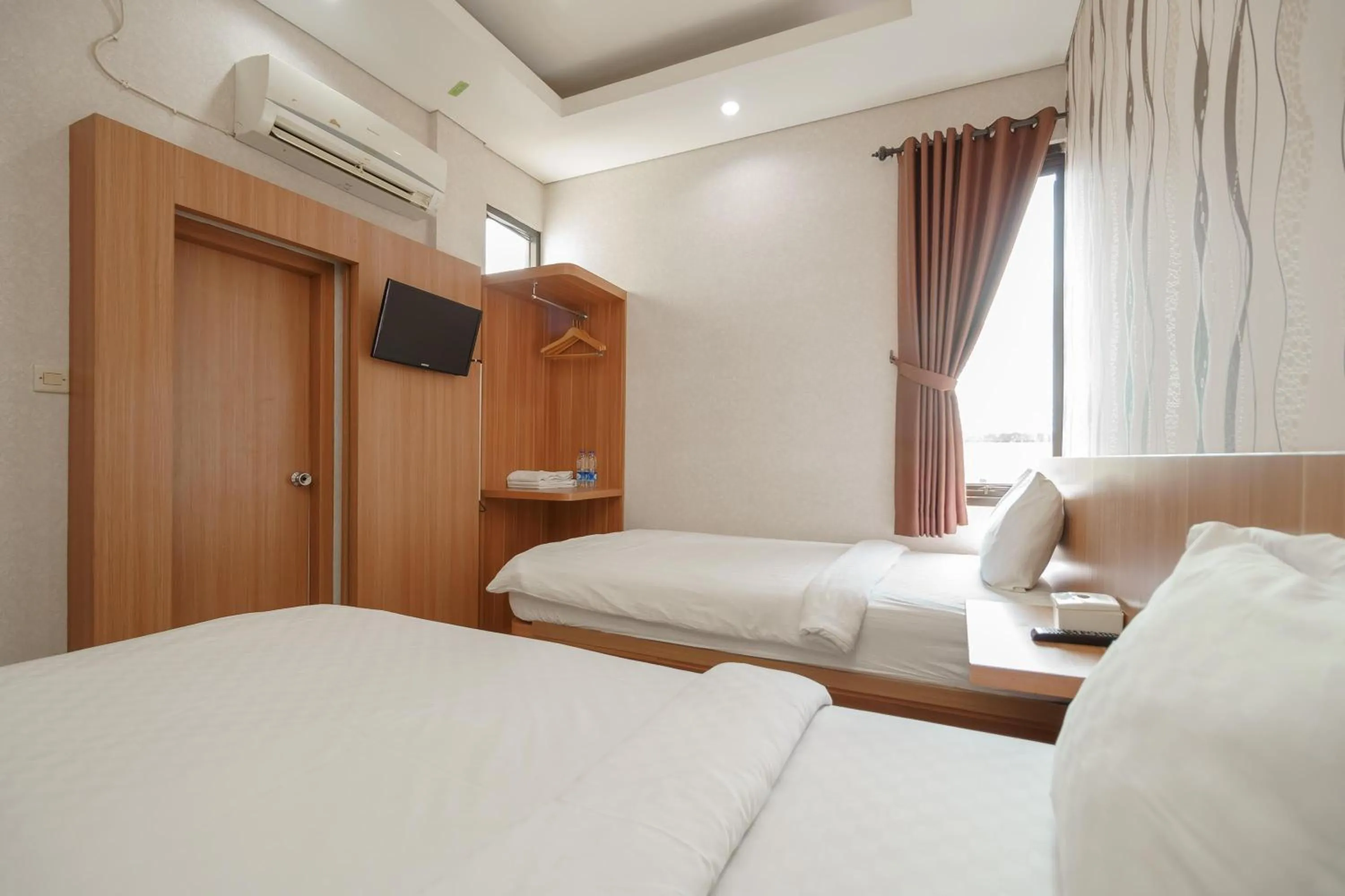 Bed in Green Apple Residence near Sarinah Mitra RedDoorz