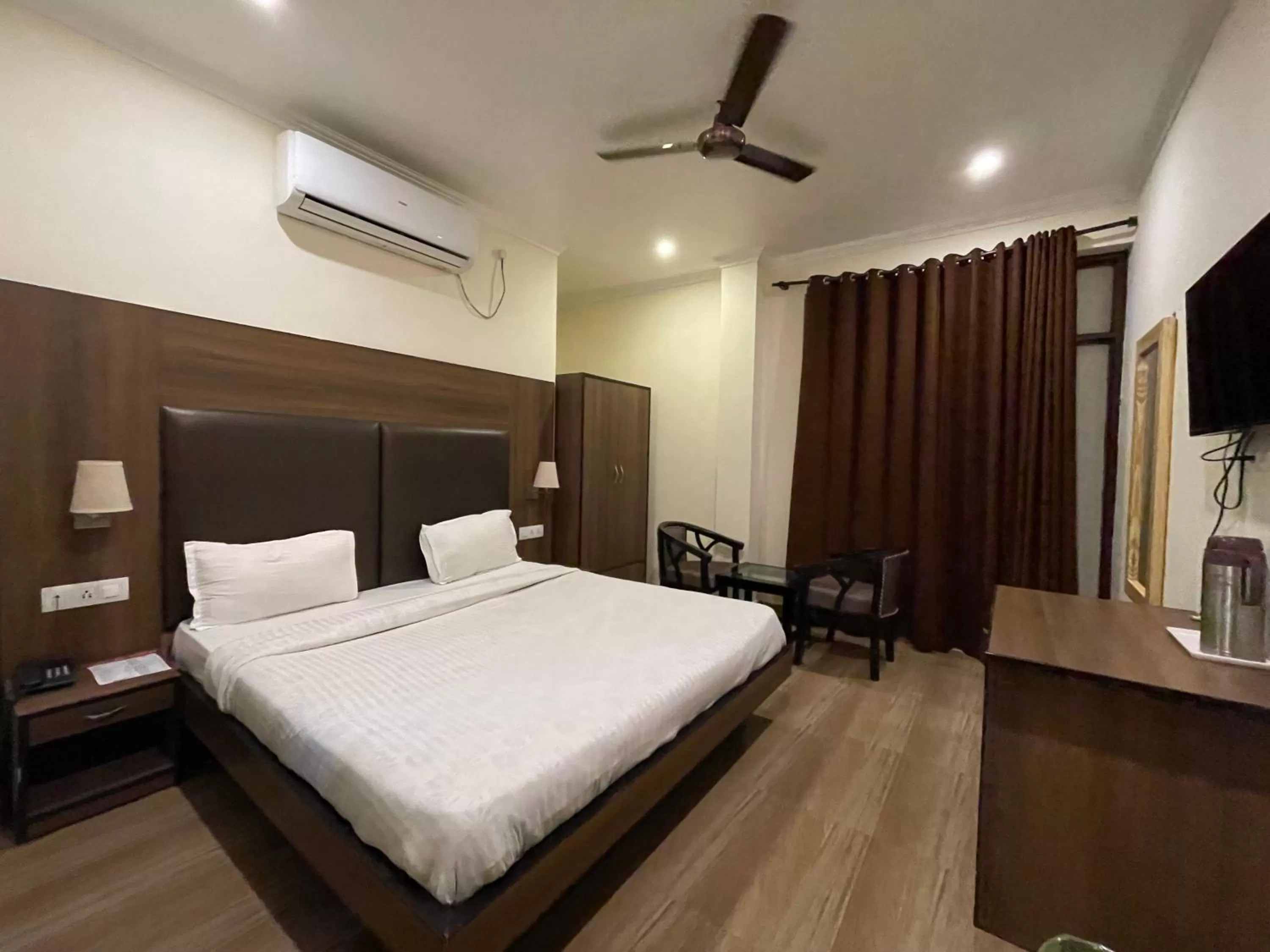Photo of the whole room, Bed in Tapasthali by Meera Hotels