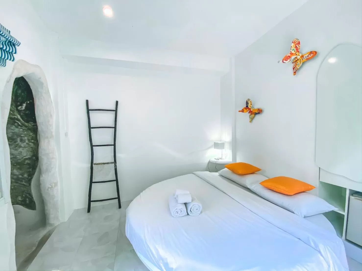 Bed in Nern Chalet Beachfront Hotel