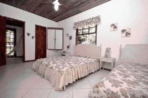 Bed in Pousada A Marca do Faraó