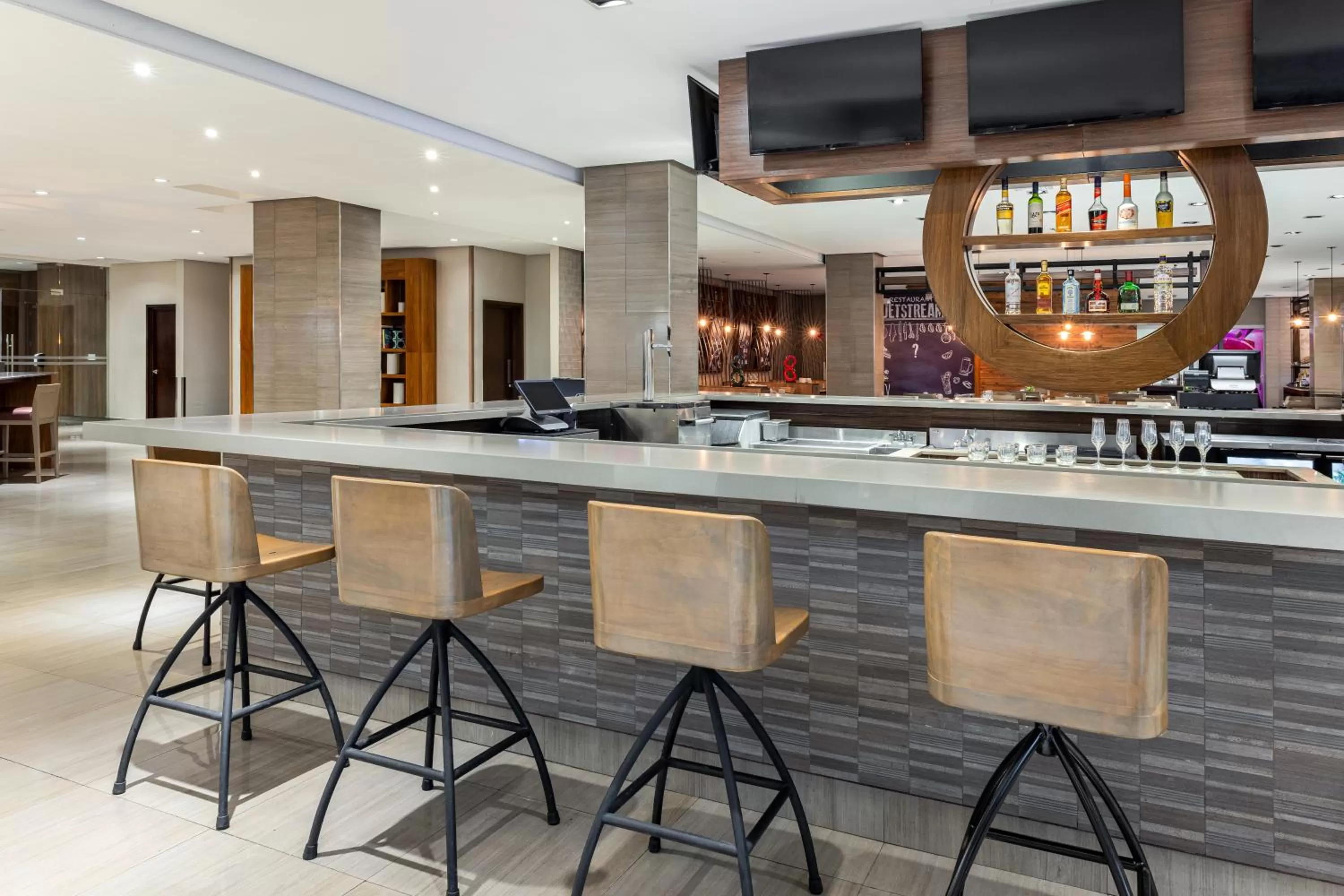 Lounge or bar in Crowne Plaza Airport by IHG