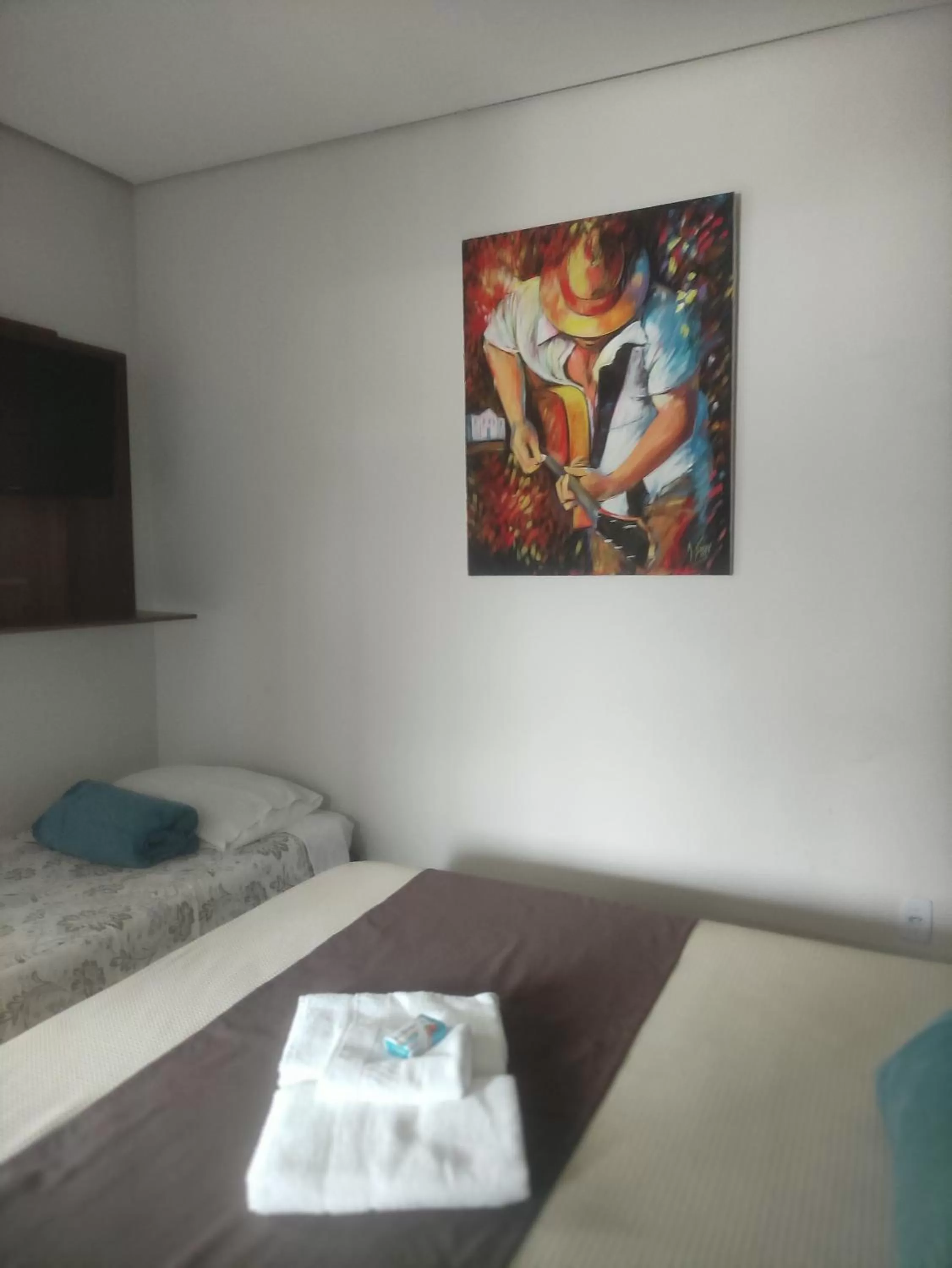 Bed in Pousada da Gi Suítes e Turismo