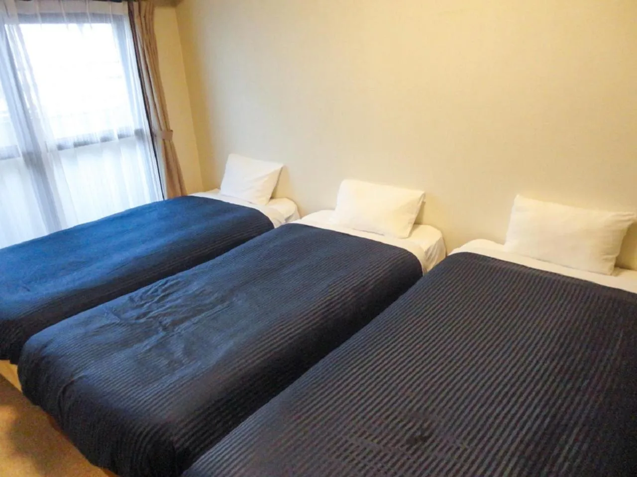 Bed in HOTEL LiVEMAX BUDGET Nagoya