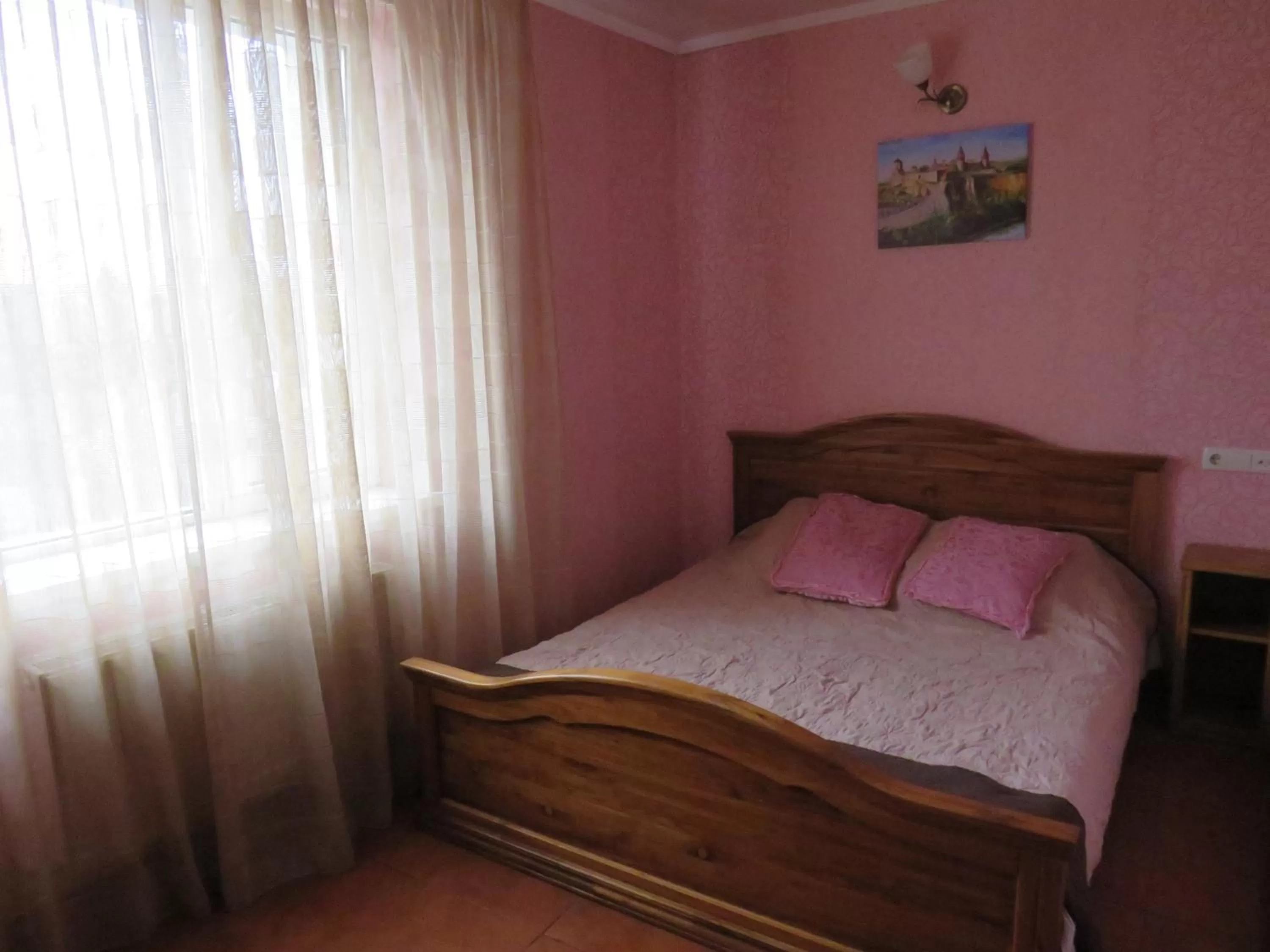 Bed in Monte-Kristo Hotel