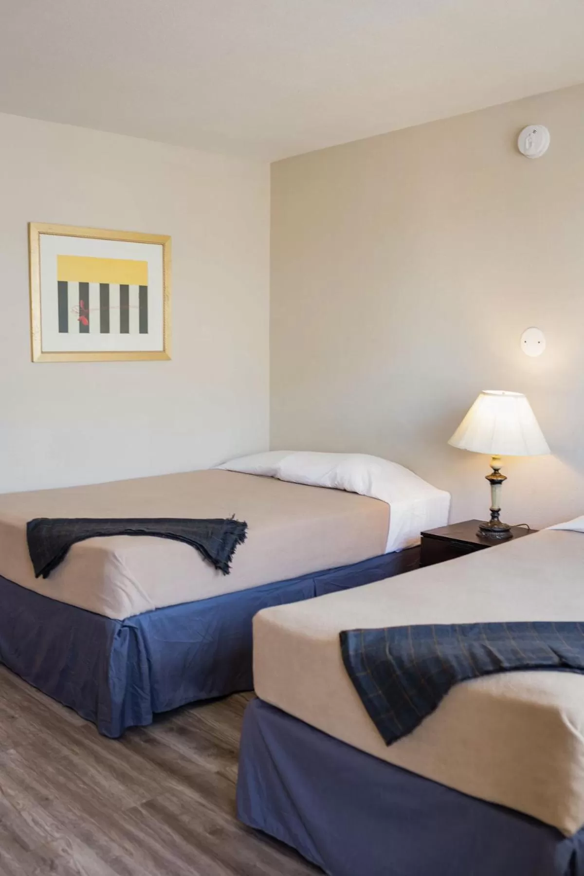 Bed in Merit Inn and Suites