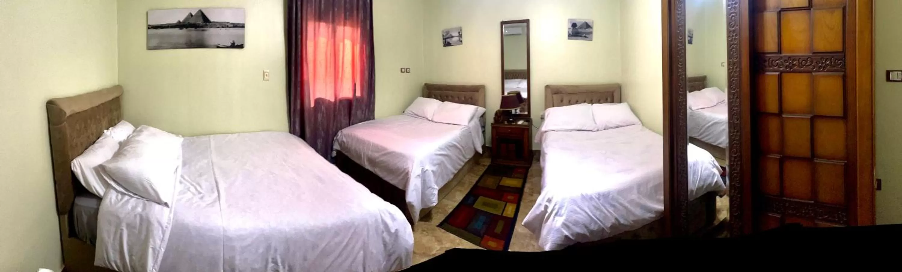 Bed in Sphinx palace pyramids view