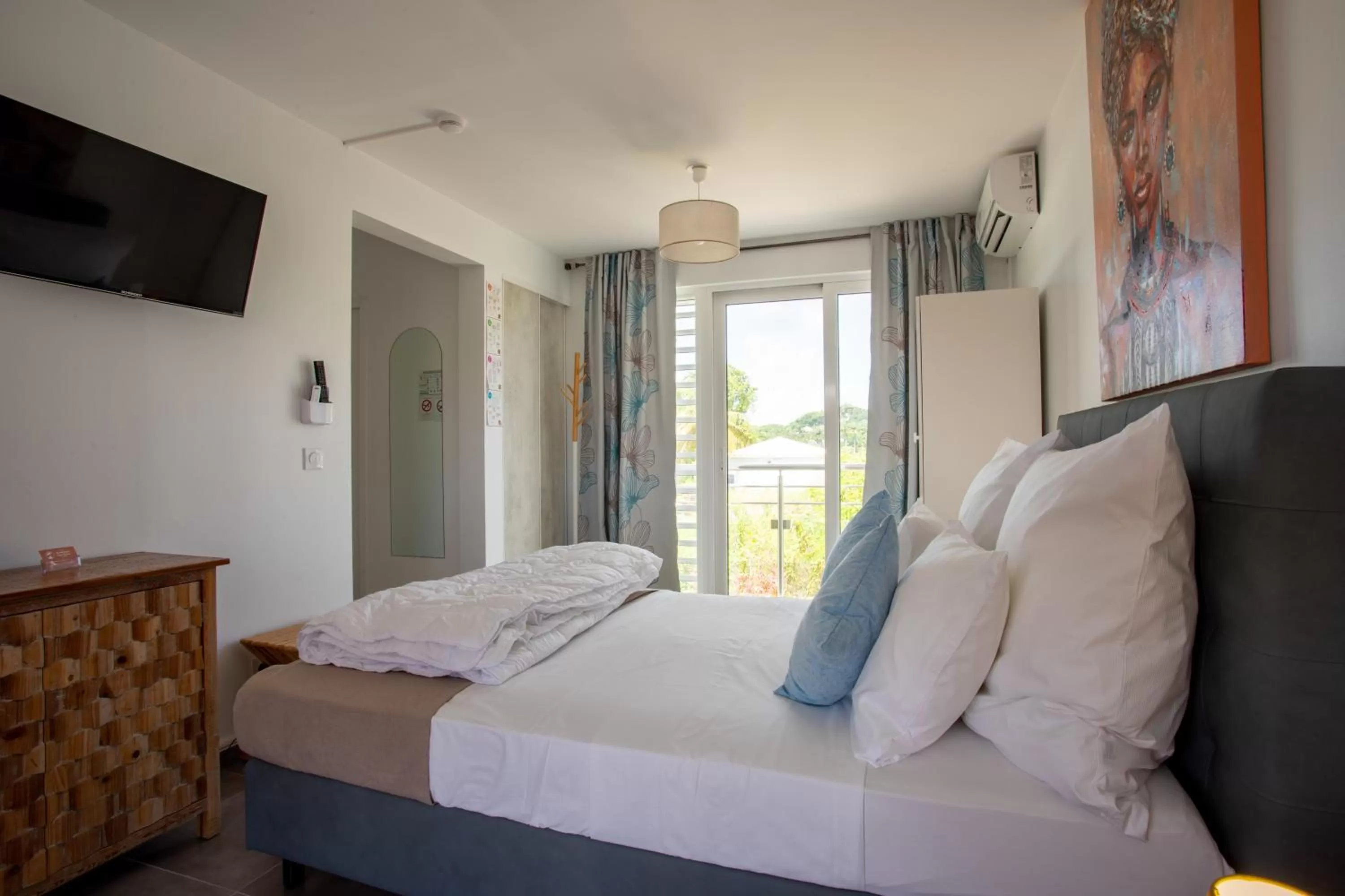 Bed in Hôtel Guadeloupe Palm Suites