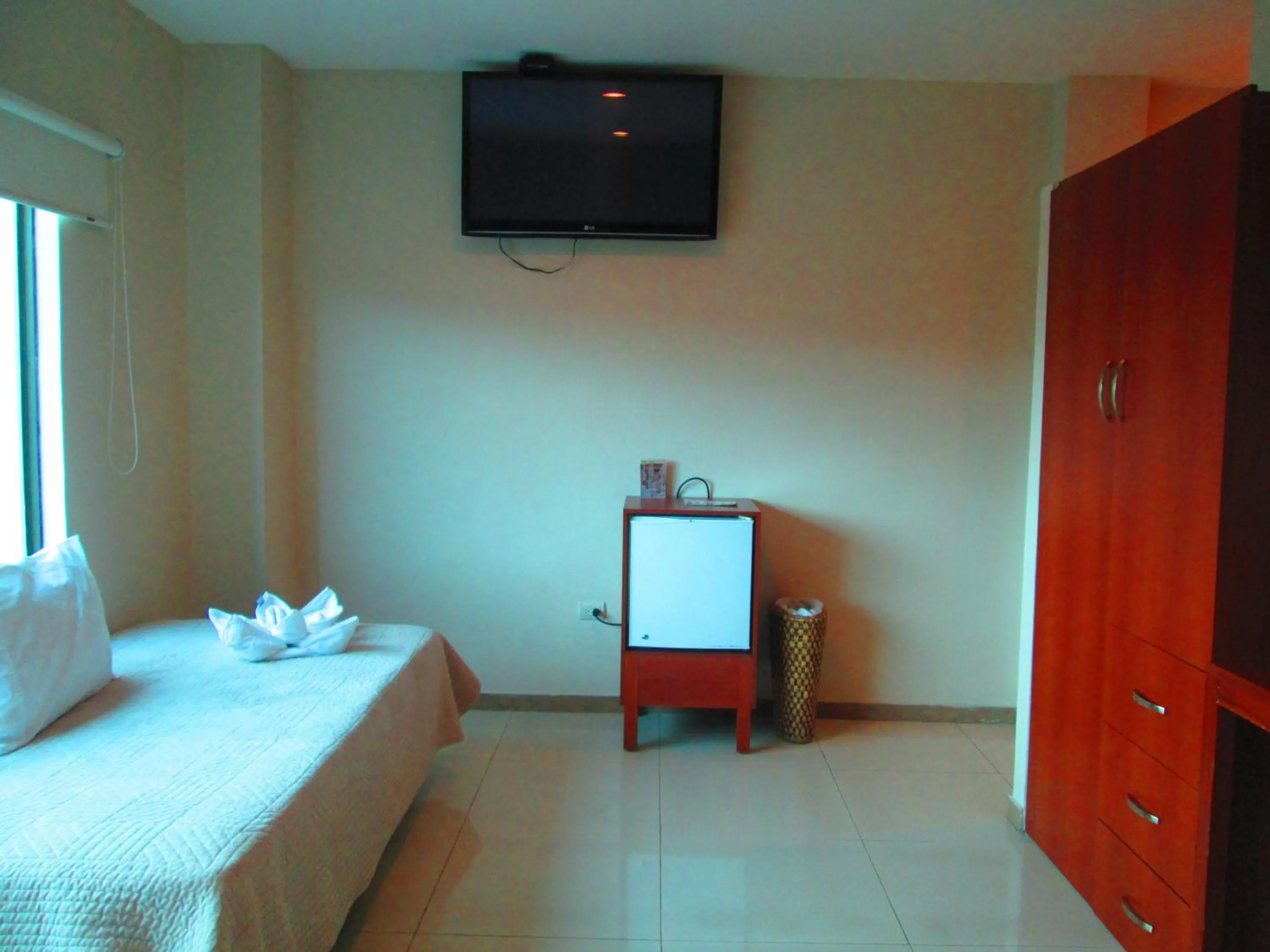 Photo of the whole room, TV/Entertainment Center in Hotel Garzota Inn