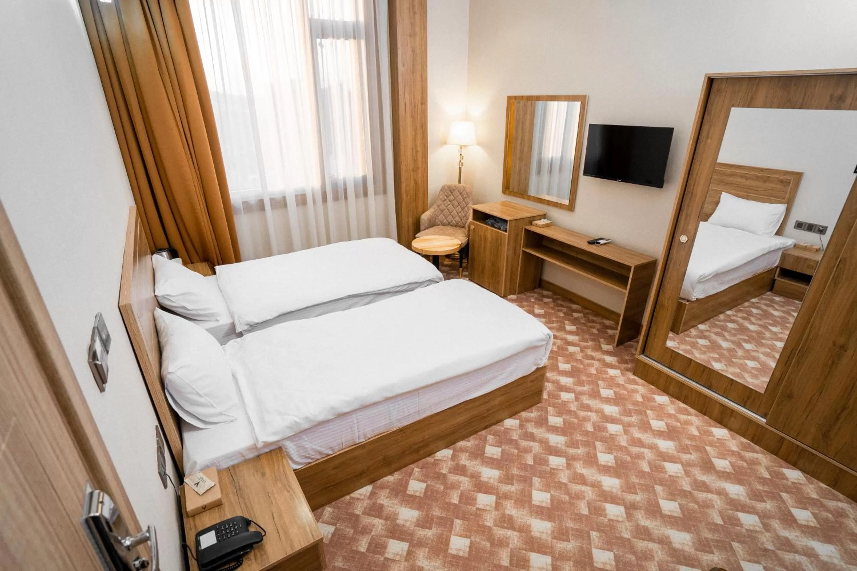 Bed in Al Yarmouk International Hotel