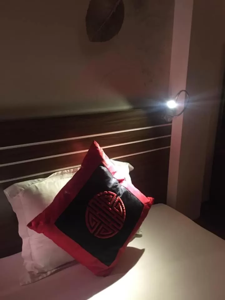 Bed in Friendly Home Hotel