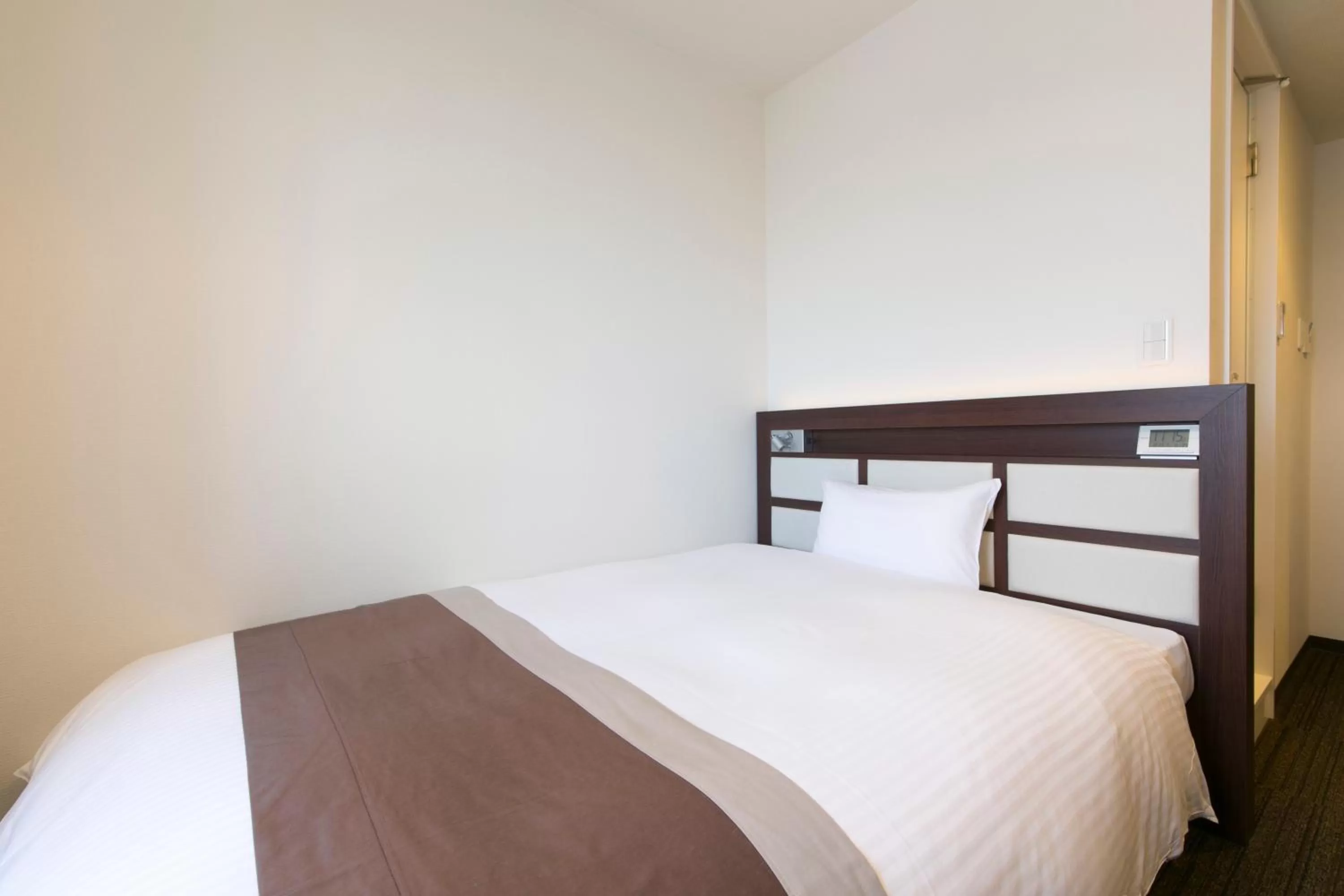 Bed in Urban Hotel Minami Kusatsu