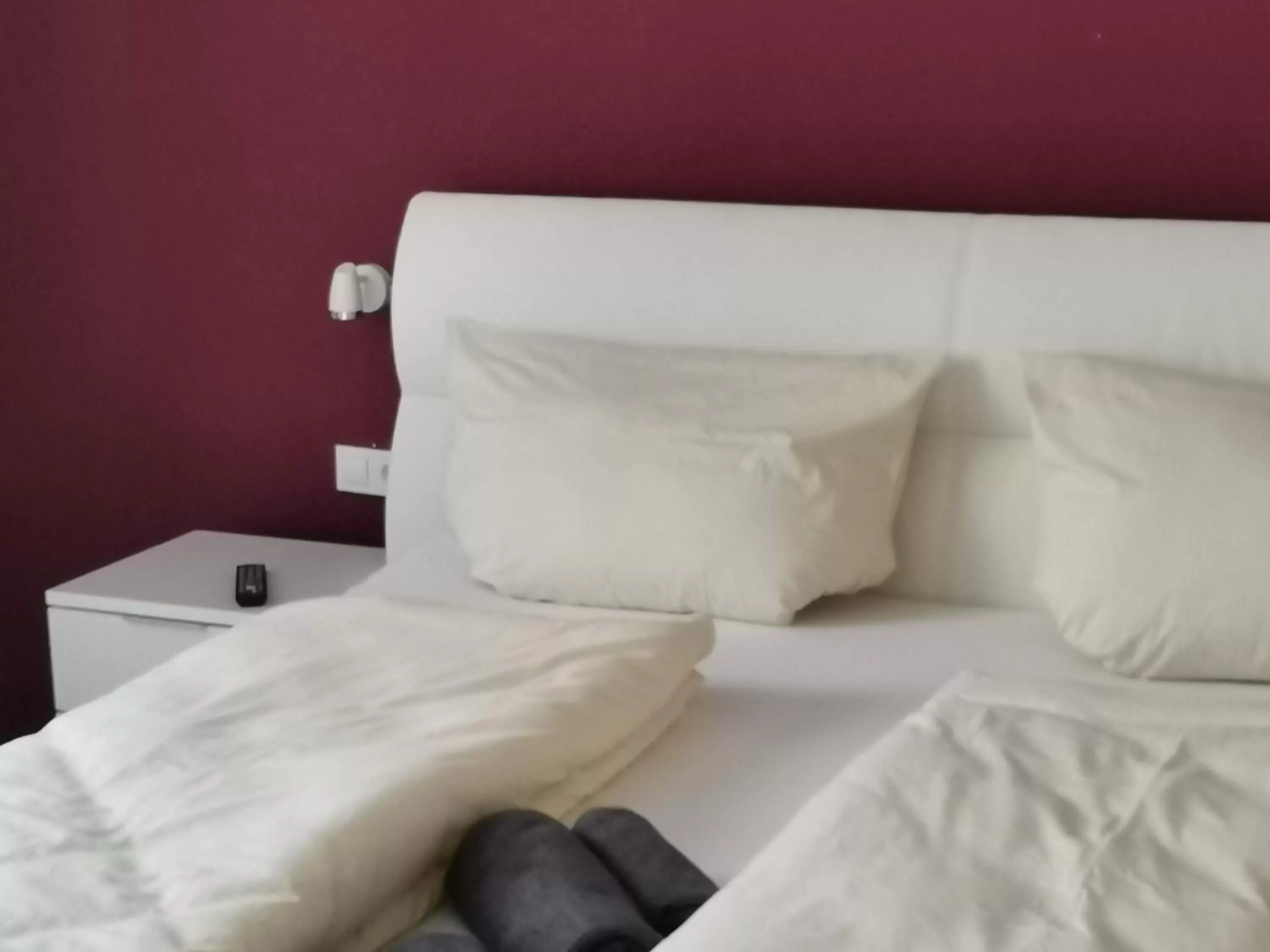 Bed in Hotel Grüner Baum - Melissone Italian Restaurant