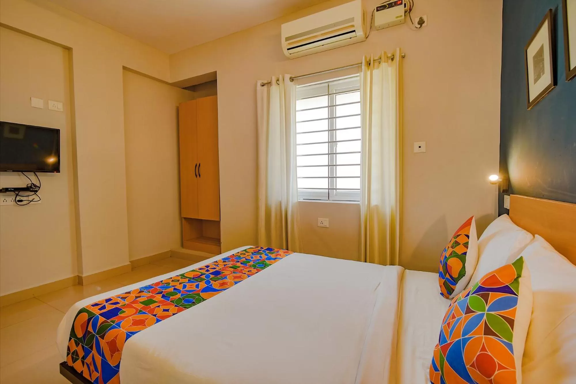 Bed in FabHotel Sasti Inn