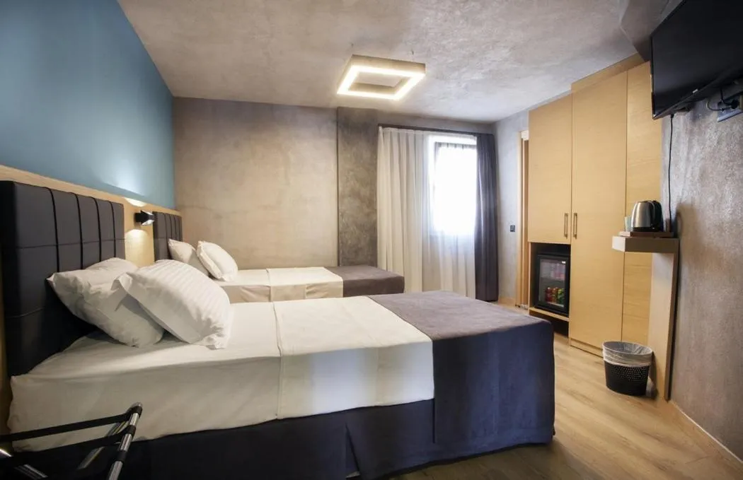 Bed in Red Stone Hotel