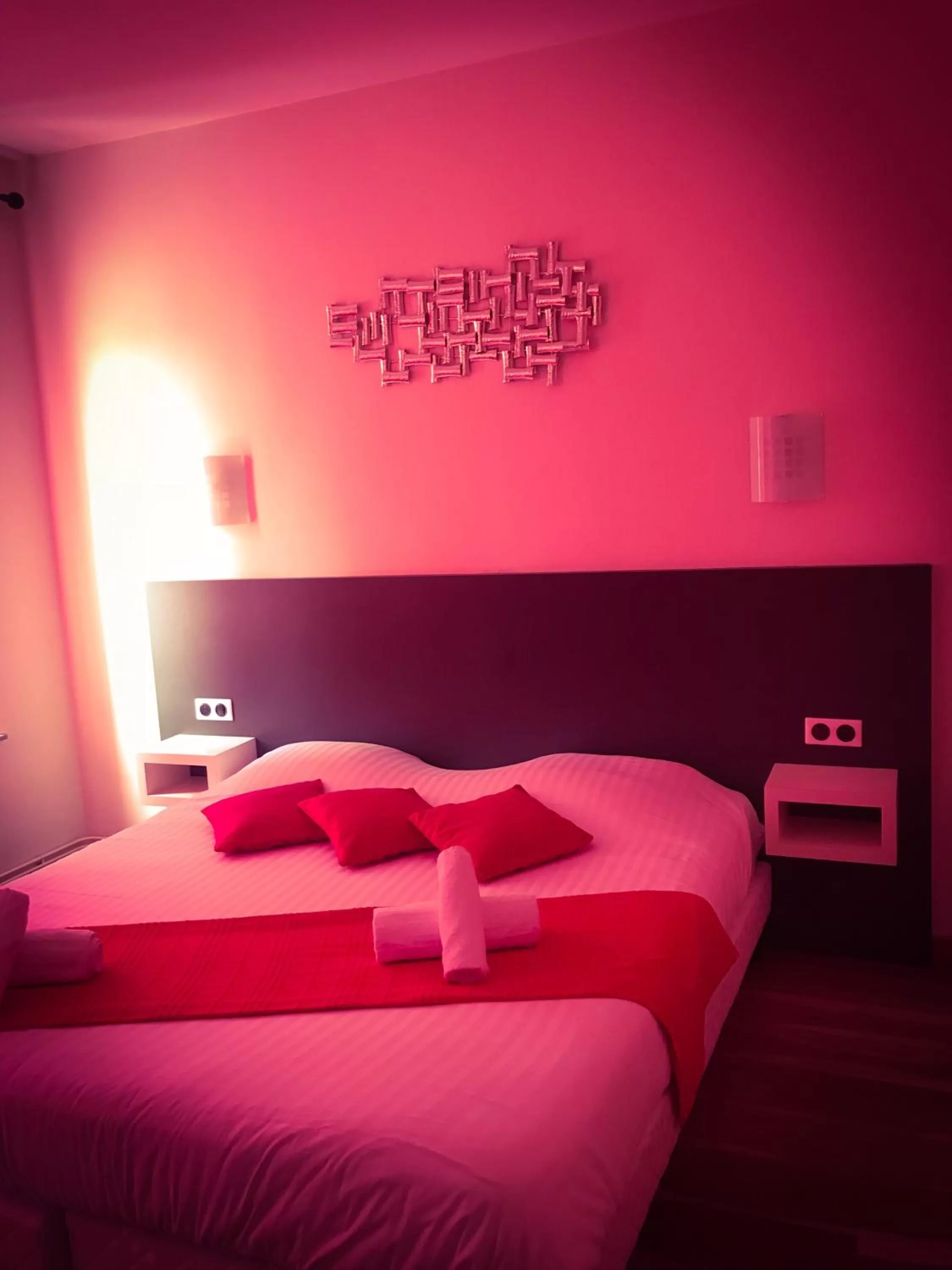 Bed in Logis Le Provençal