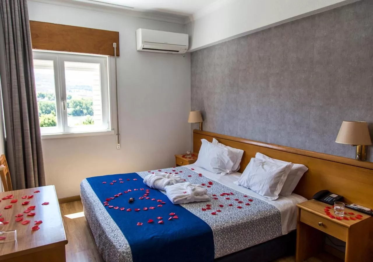 Bed in Hotel Columbano