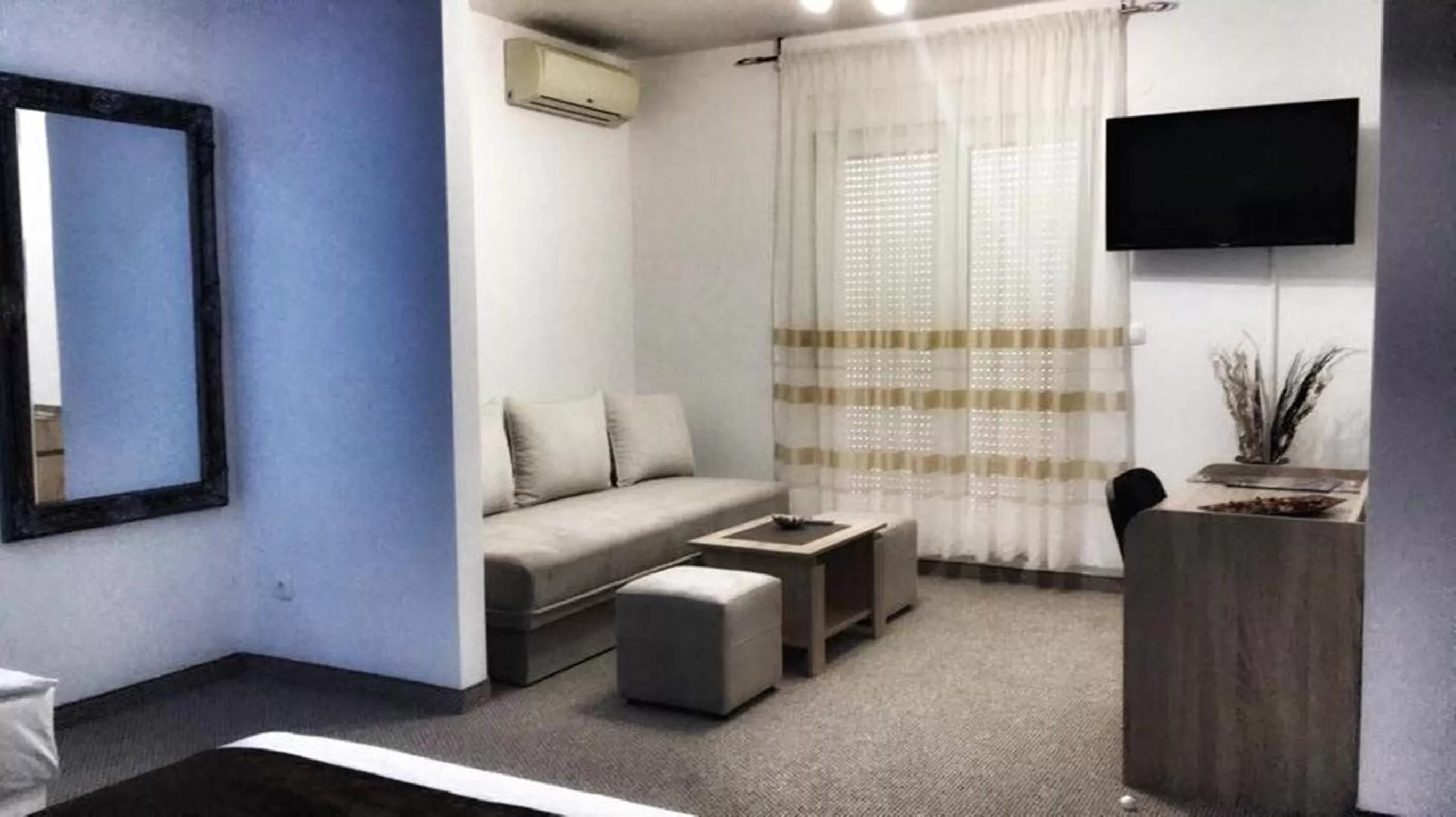 Bed, Seating Area in Motel Aura