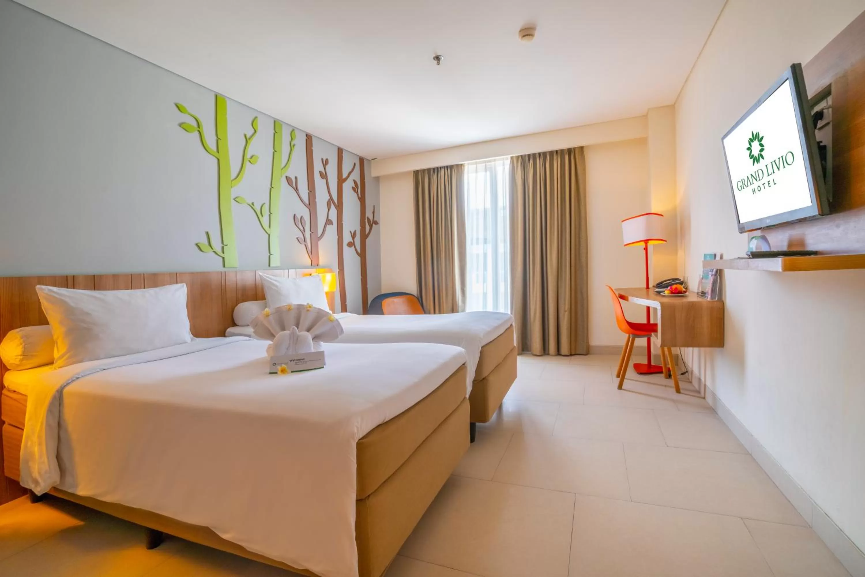 Photo of the whole room, Bed in Grand Livio Kuta Hotel