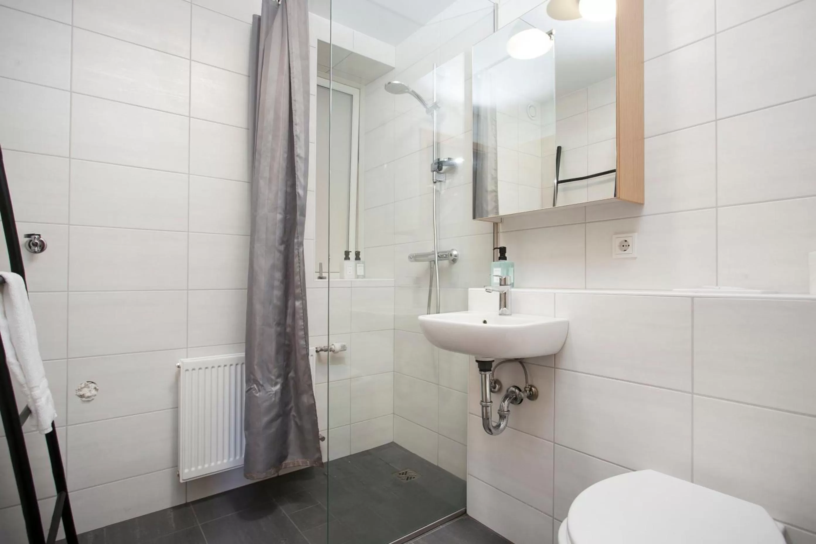 Bathroom in Tyr Apartments by Heimaleiga