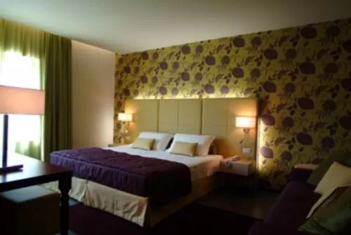 Bedroom, Bed in El Homs Palace Hotel