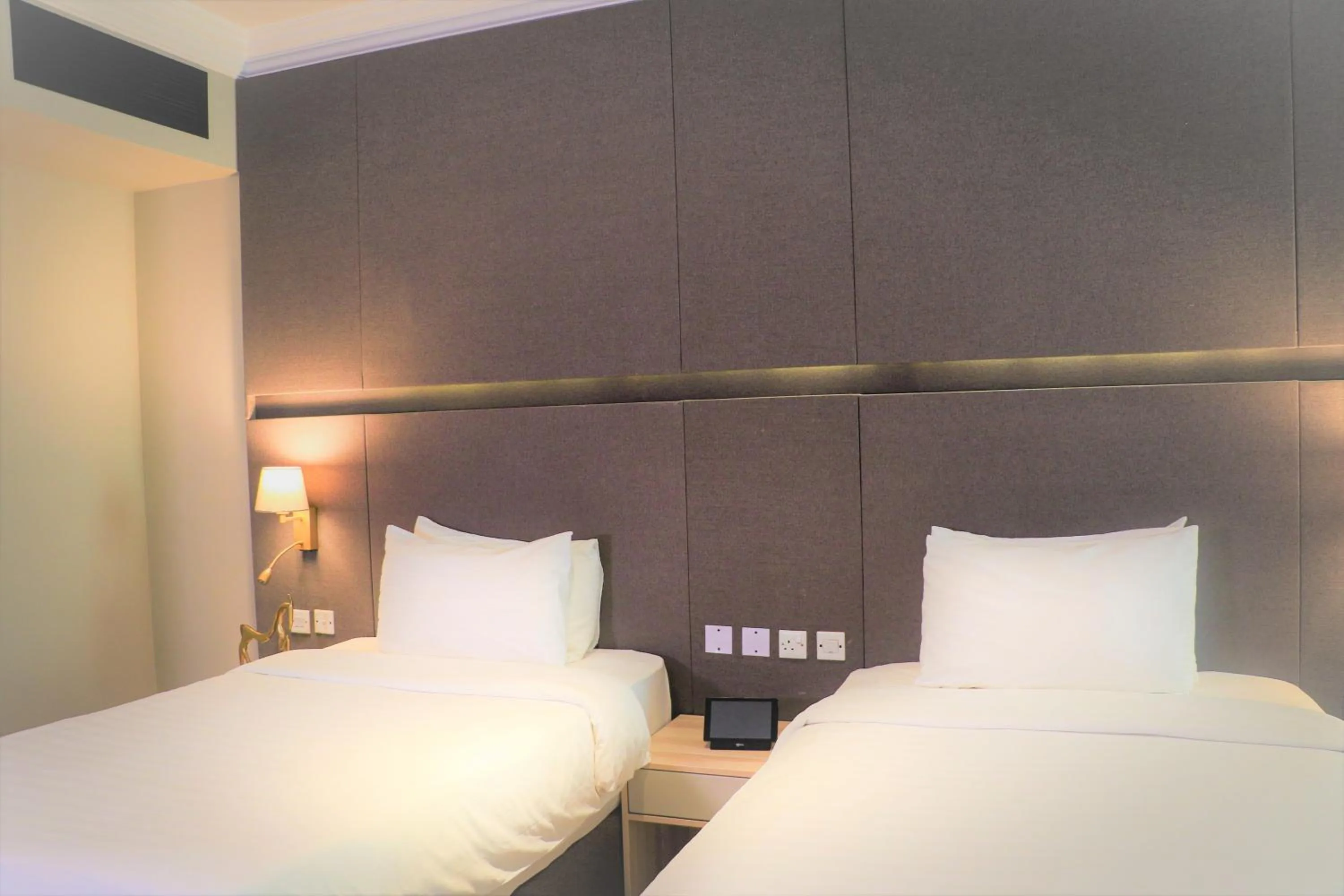 Bed in Ramada by Wyndham Doha Old Town