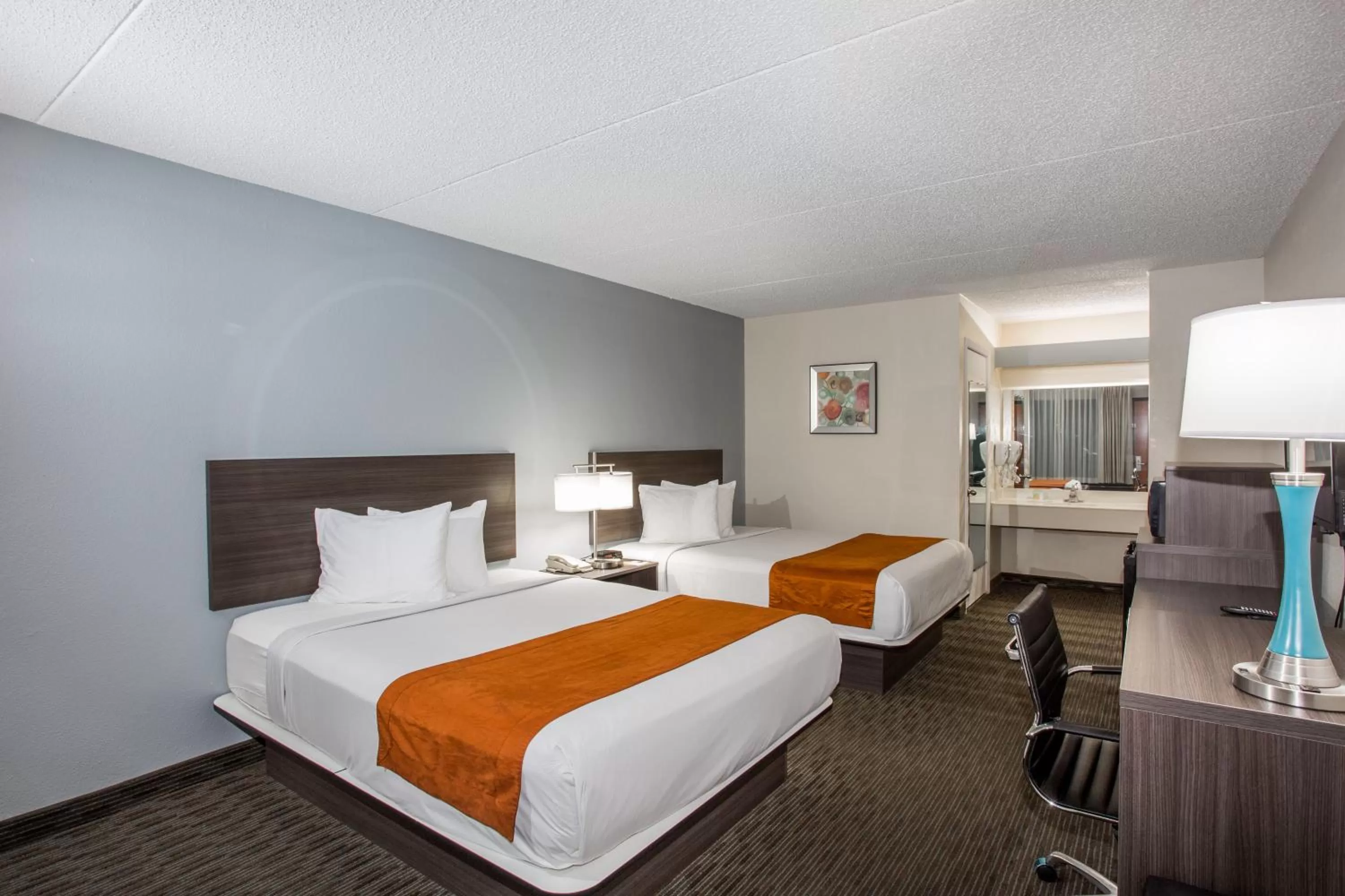 Photo of the whole room, Bed in Days Inn & Suites by Wyndham Orlando Airport