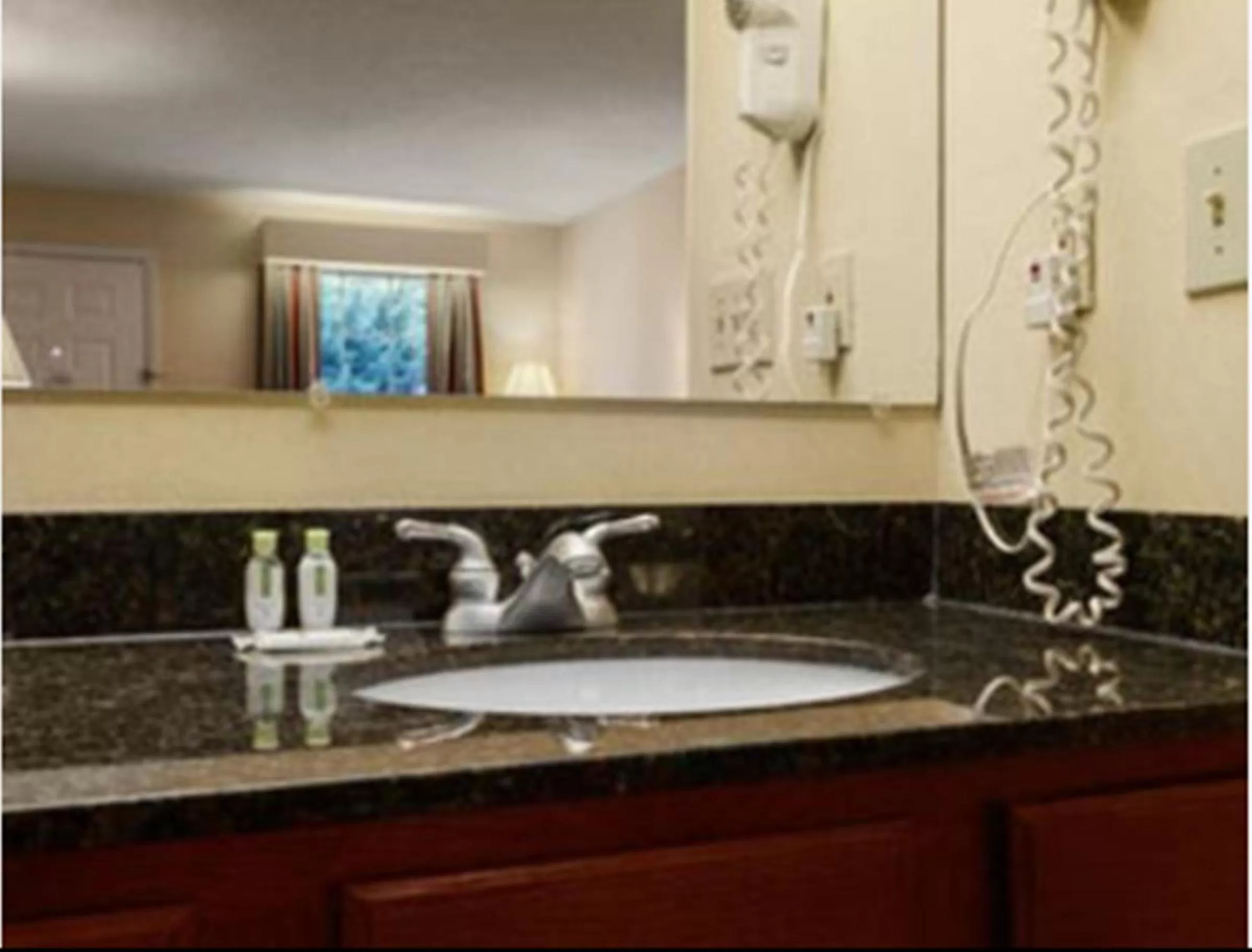 Toilet in Baymont by Wyndham Warner Robins