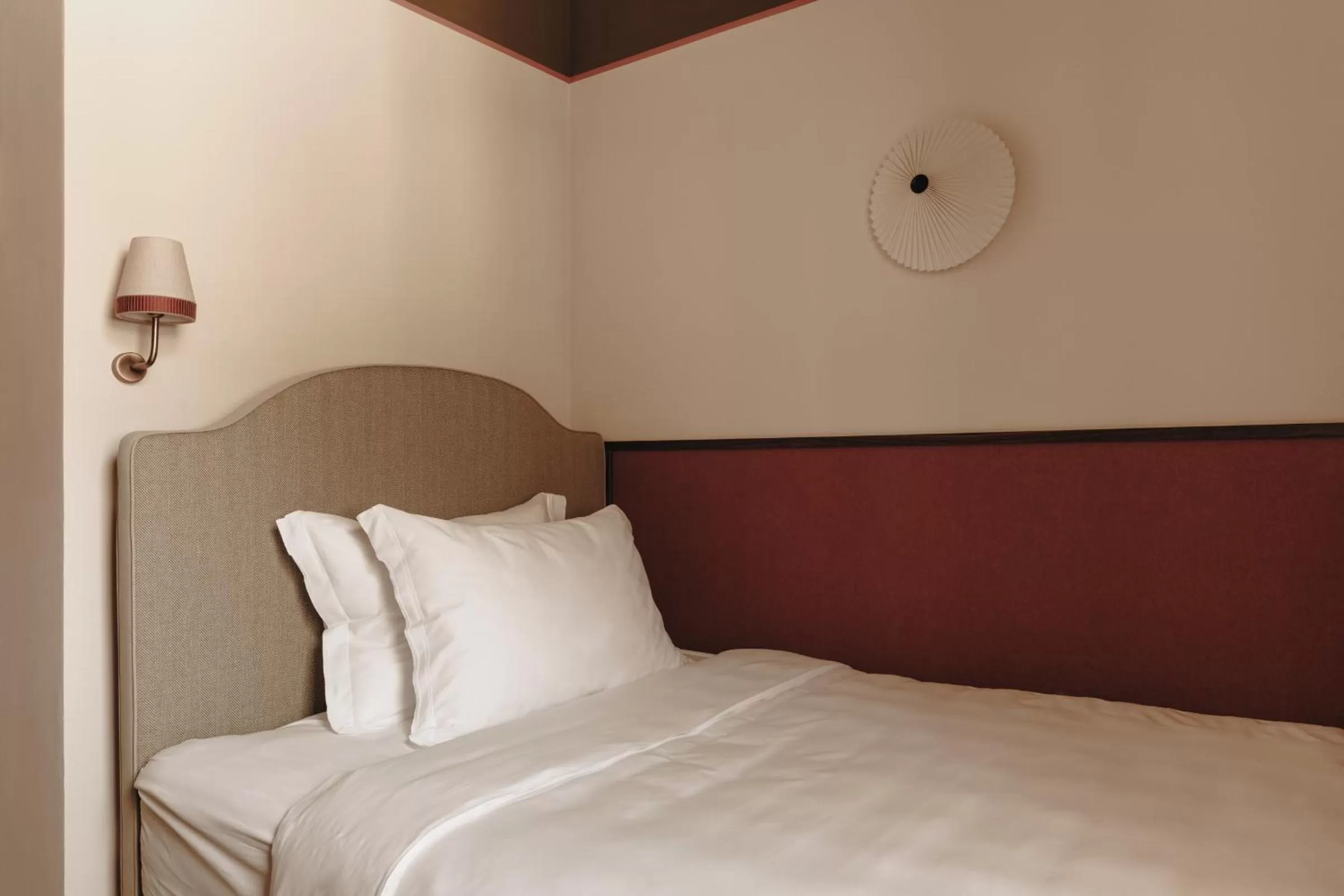 Bed in Parkhotel Mondschein, a Member of Design Hotels