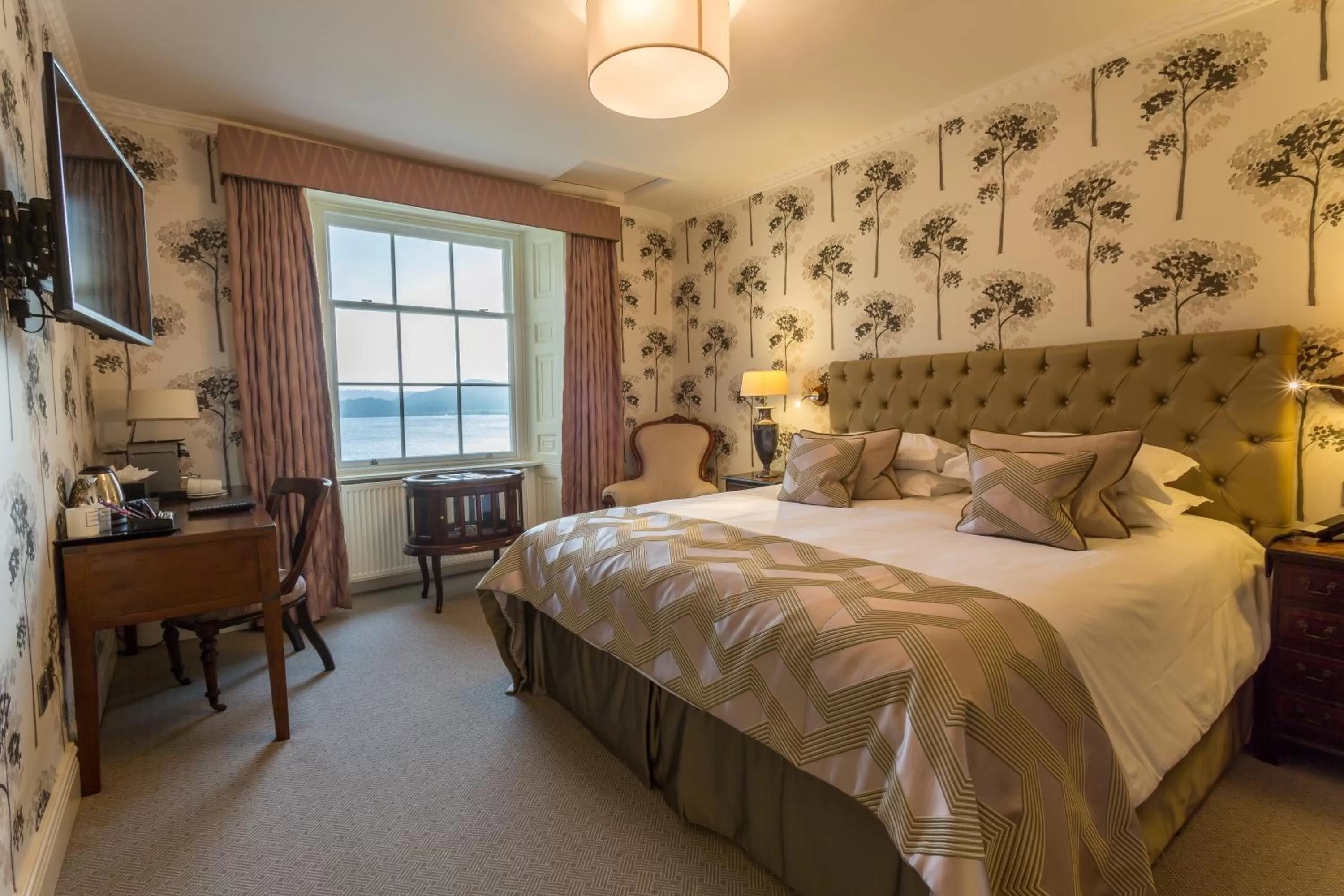 Lake view, Bed in Storrs Hall Hotel on the shore of Lake Windermere